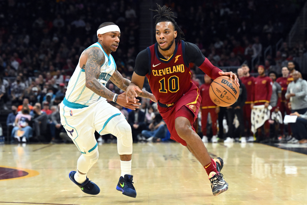 Darius Garland of the Cleveland Cavaliers drives to the basket against Isaiah Thomas of the Charlotte Hornets.