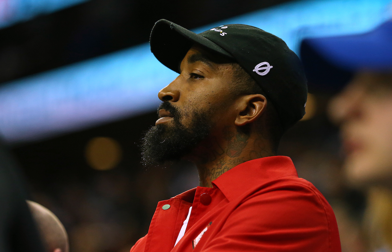 JR Smith takes in a college basketball game.