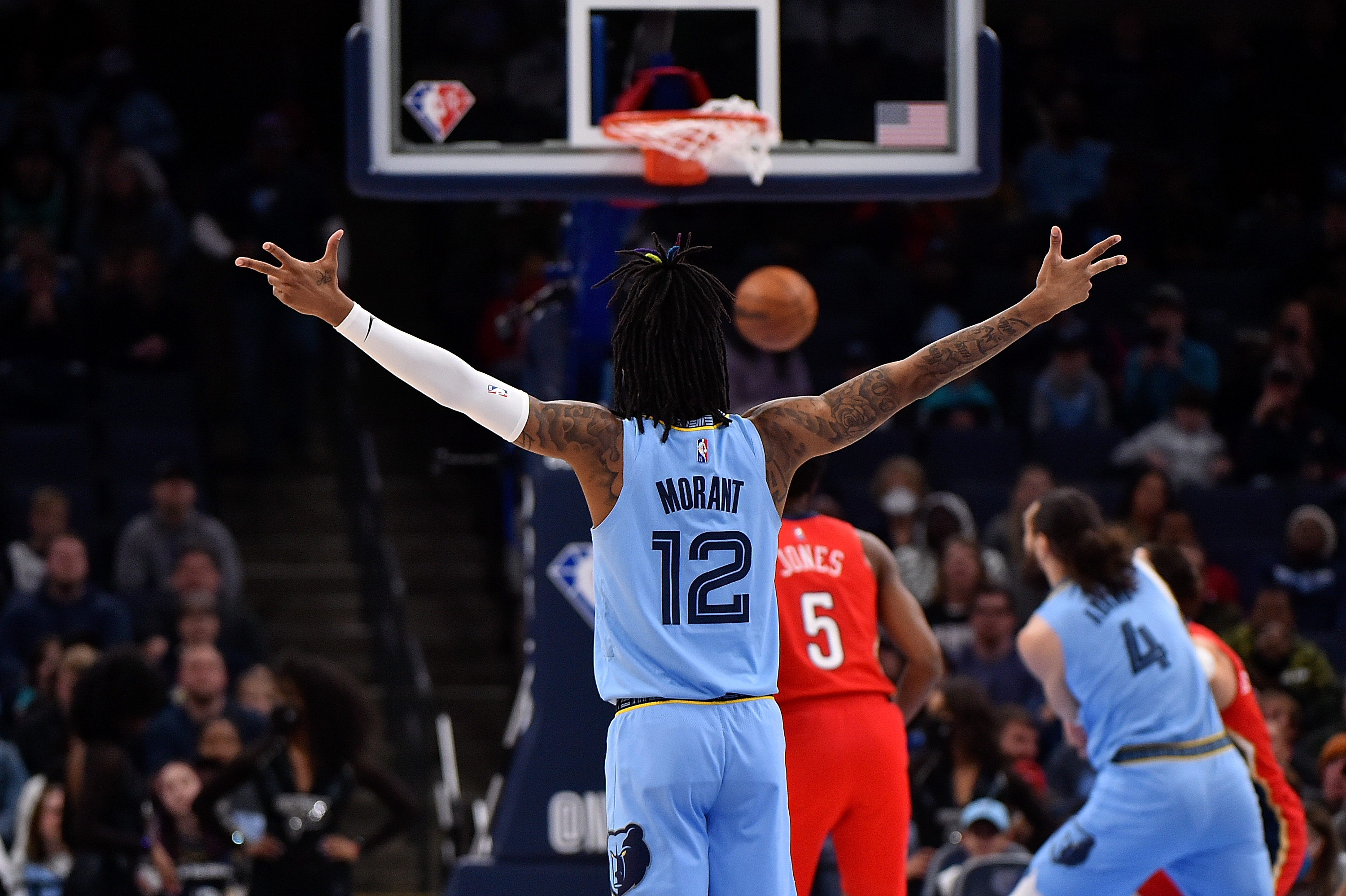 Memphis Grizzlies star Ja Morant reacts to a basket during an NBA game against the New Orleans Pelicans during an NBA game in March 2022