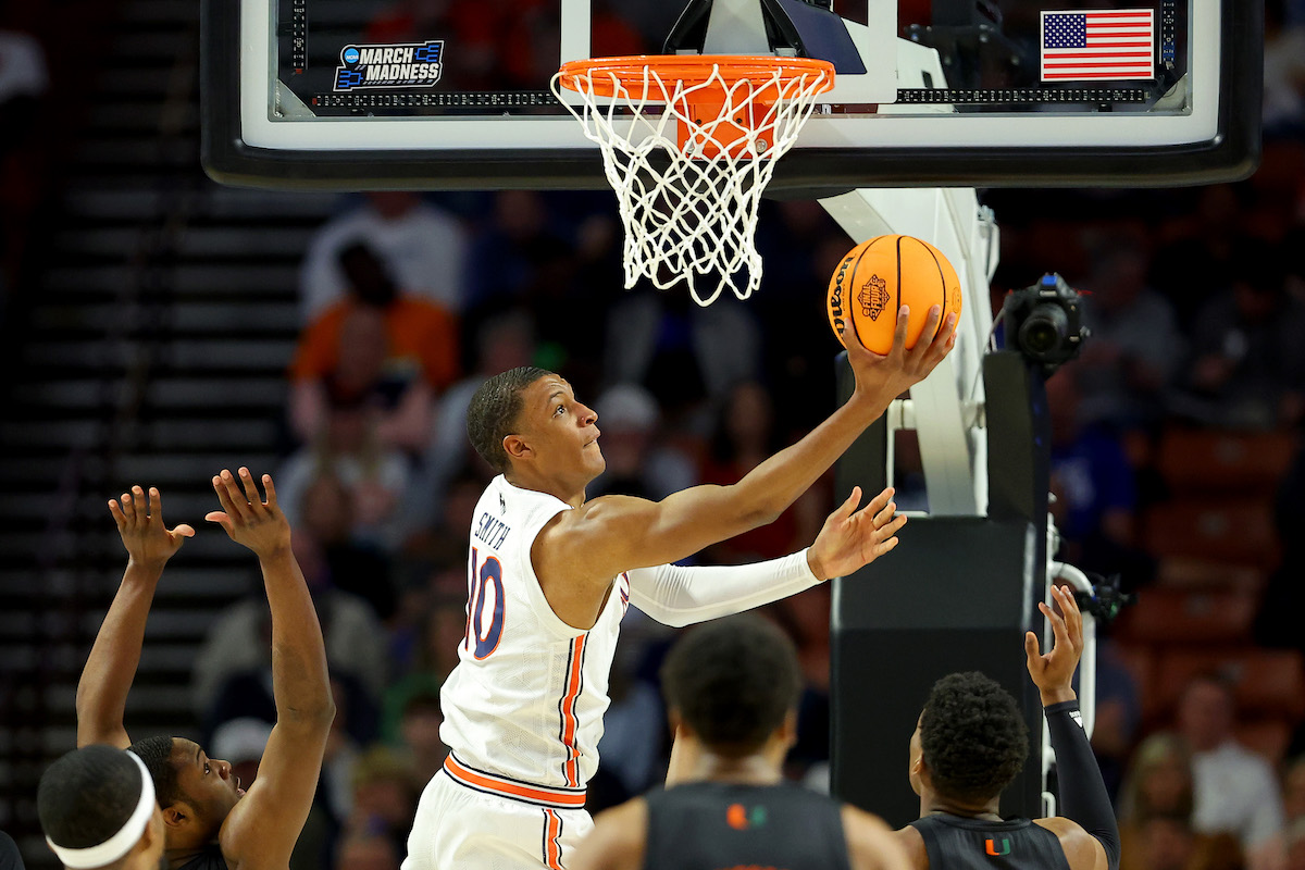 Jabari Smith goes up for a reverse layup against Miami