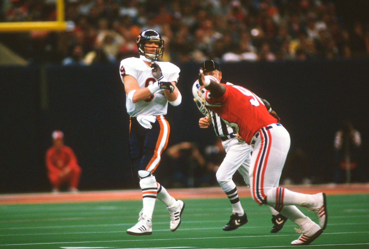 Jim McMahon of the Chicago Bears gets his pass off over Dennis Owens of the New England Patriots during Super Bowl 20.