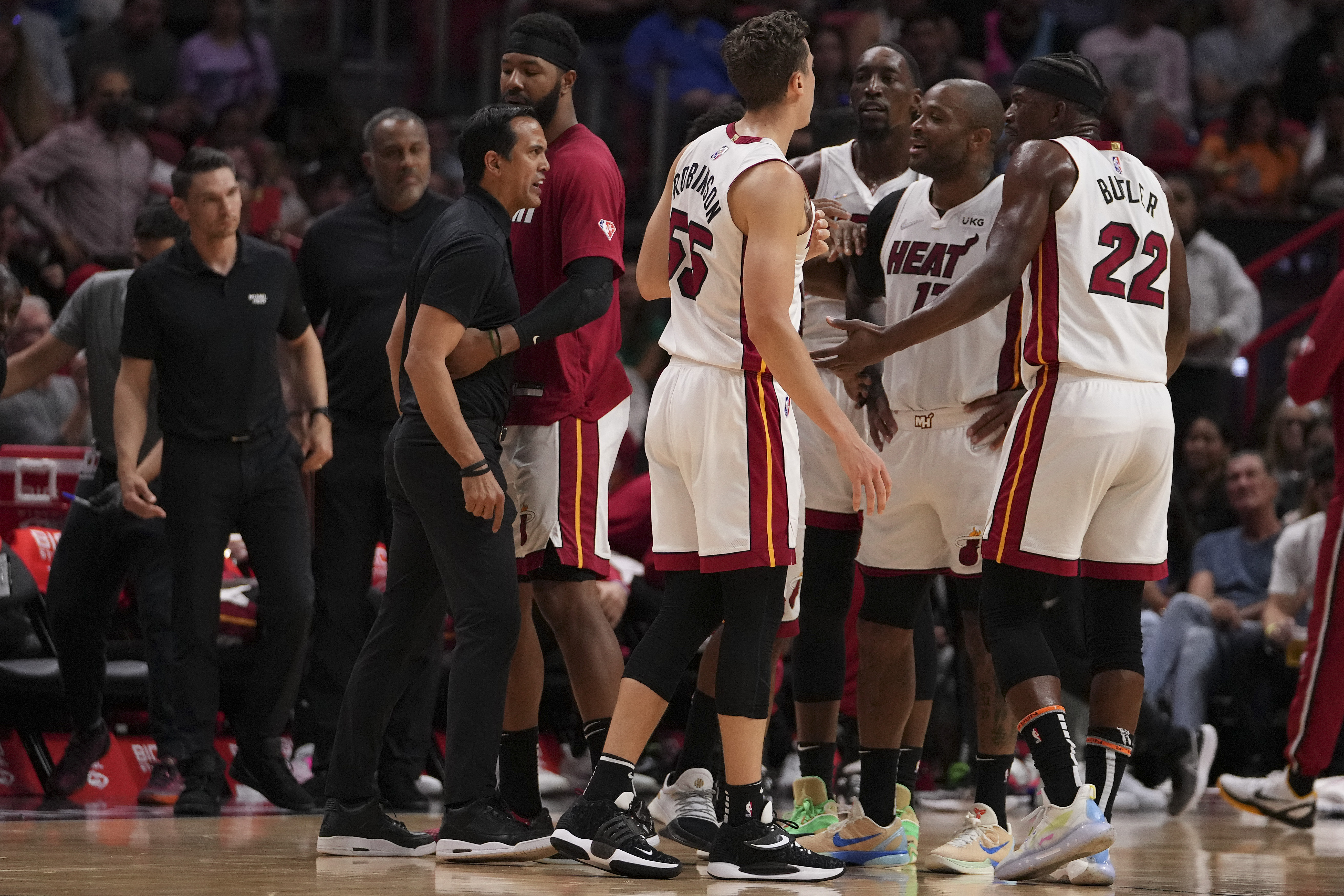 Miami Heat head coach Erik Spoelstra yells at Heat forward Jimmy Butler #22 during an NBA game against the Golden State Warriors in March 2022