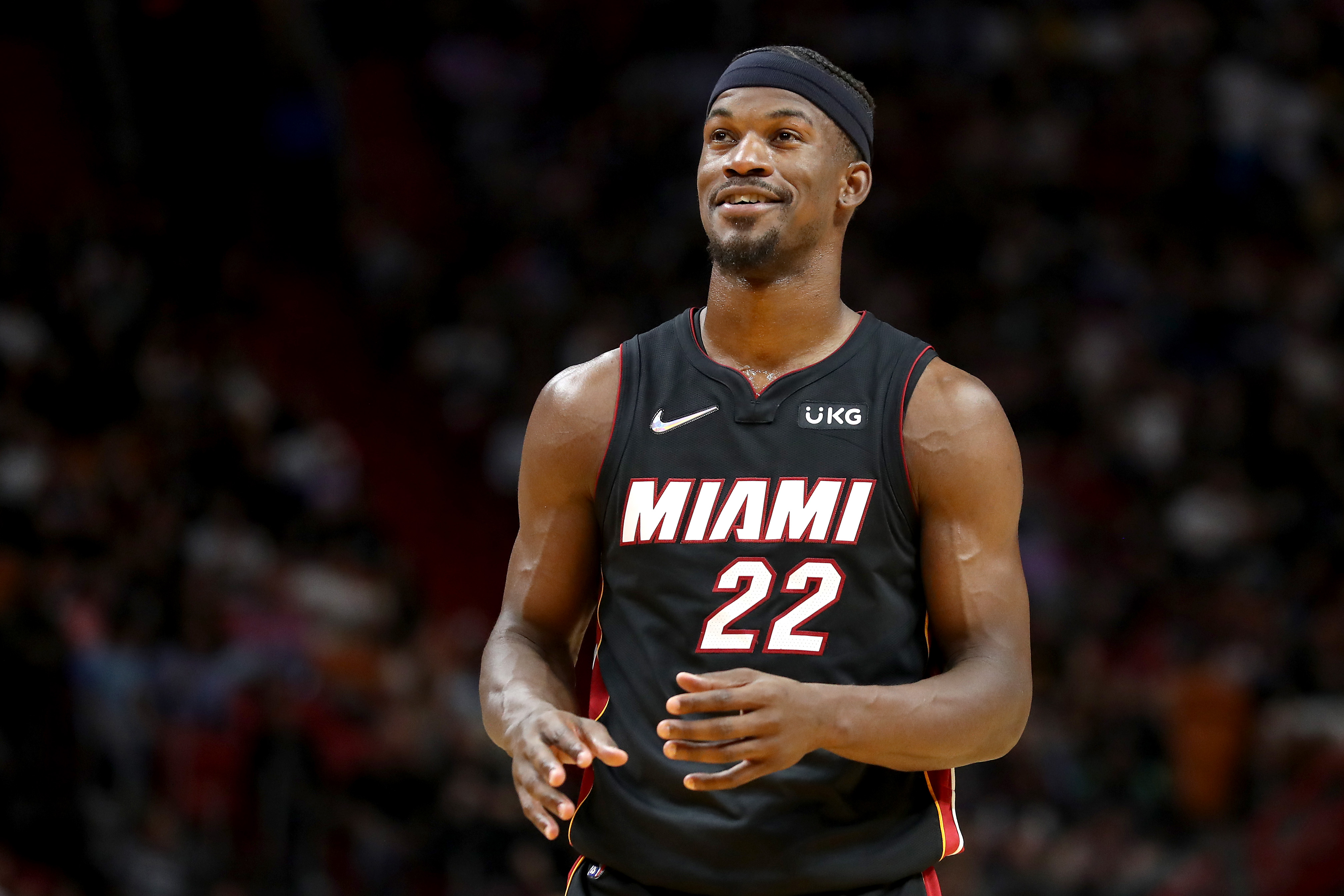 Miami Heat wing Jimmy Butler smiles during an NBA game against the San Antonio Spurs in February 2022