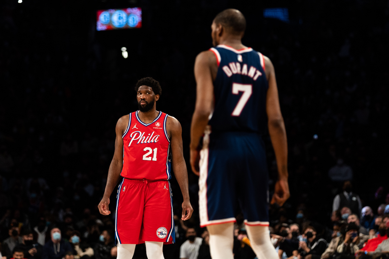 Joel Embiid looks at Kevin Durant.