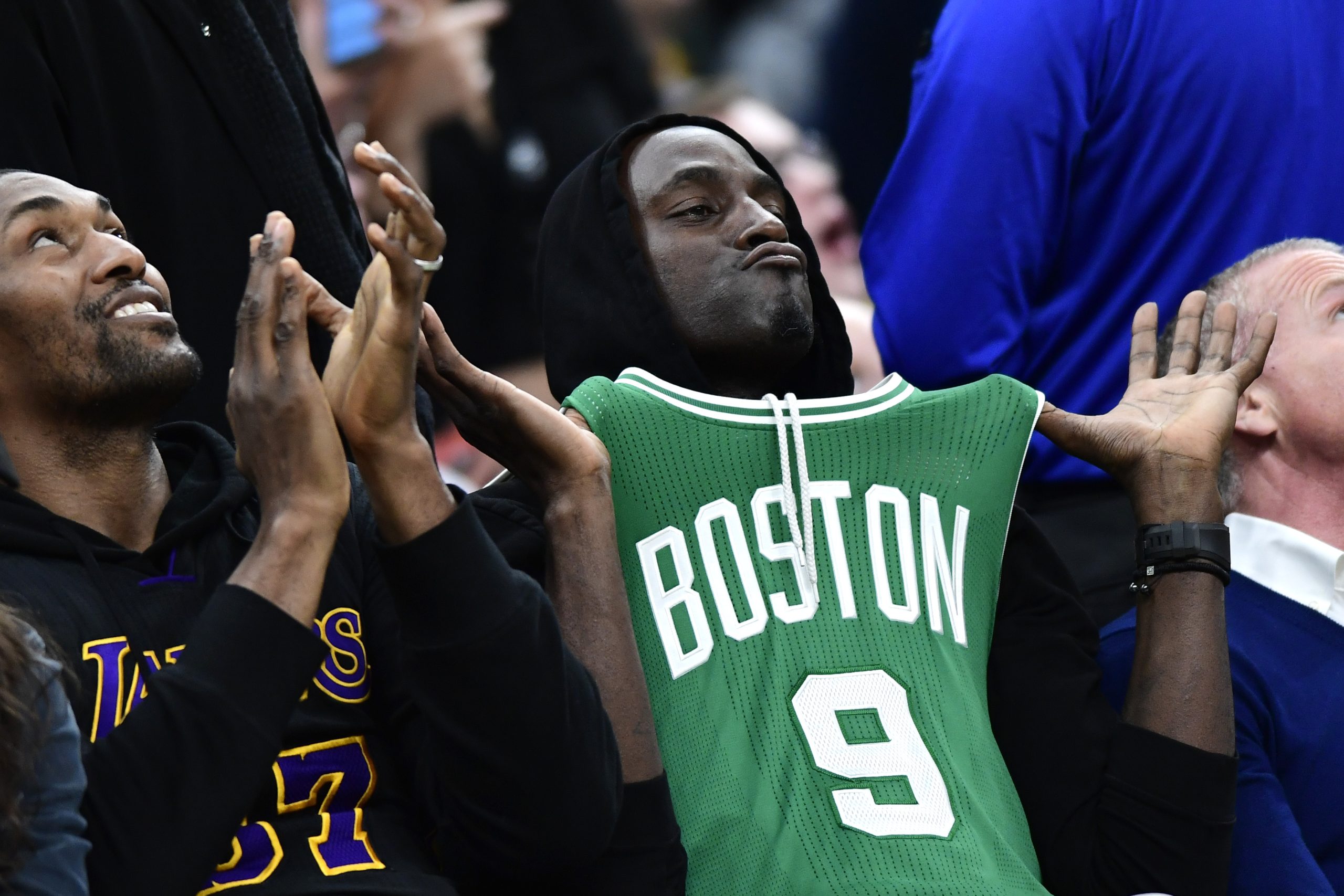 Former Celtics' Kevin Garnett wears a Rajon Rondo Celtics jersey.