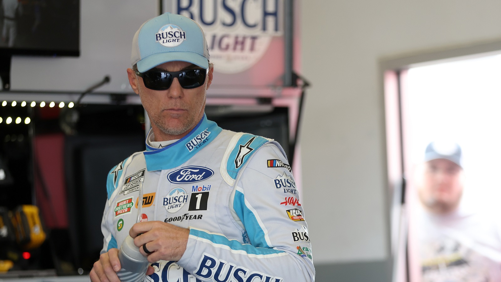 Kevin Harvick, driver of the No. 4 Ford, waits in the garage area during practice for the NASCAR Cup Series Daytona 500 at Daytona International Speedway on Feb. 18, 2022.