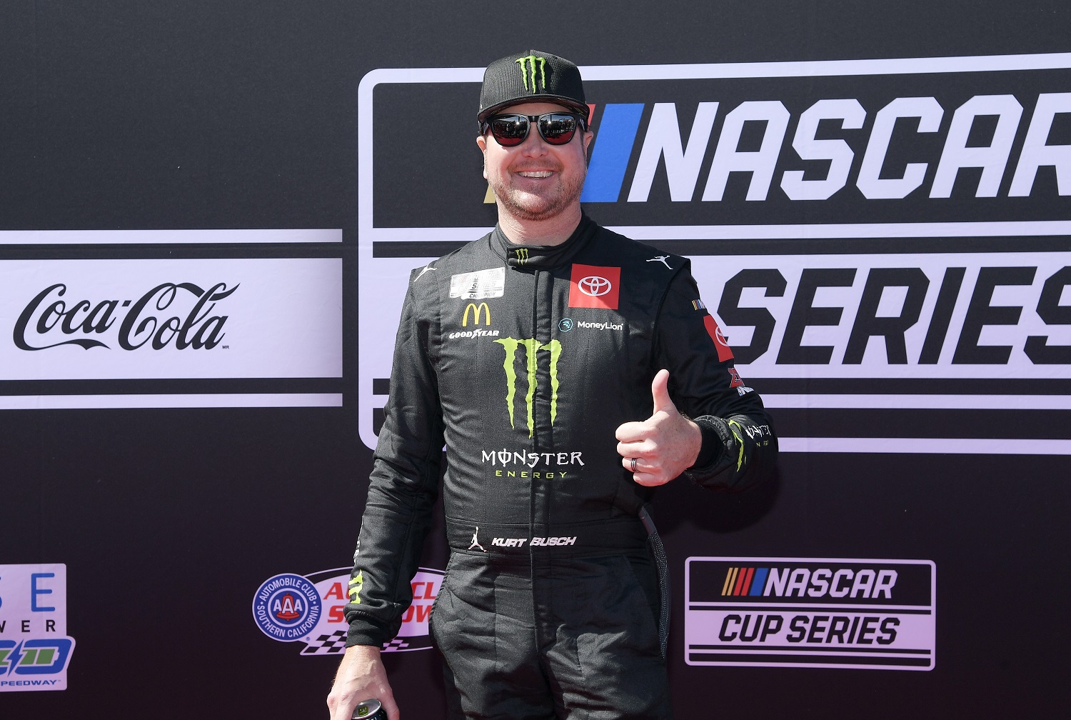 Kurt Busch, driver of the No. 45 Toyota, poses on the red carpet before the start of NASCAR Cup Series Wise Power 400 at the Auto Club Speedway on Feb. 27, 2022.