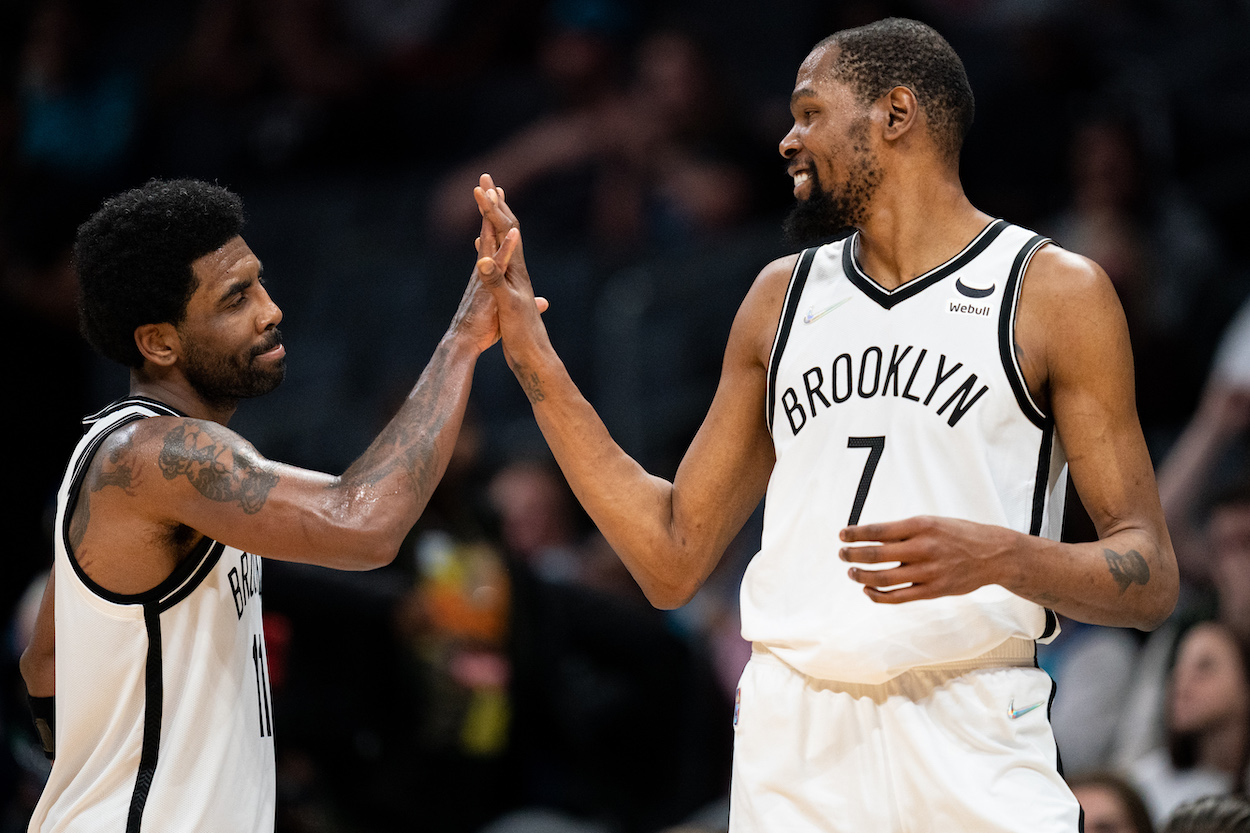 Kevin Durant and Kyrie Irving high five.