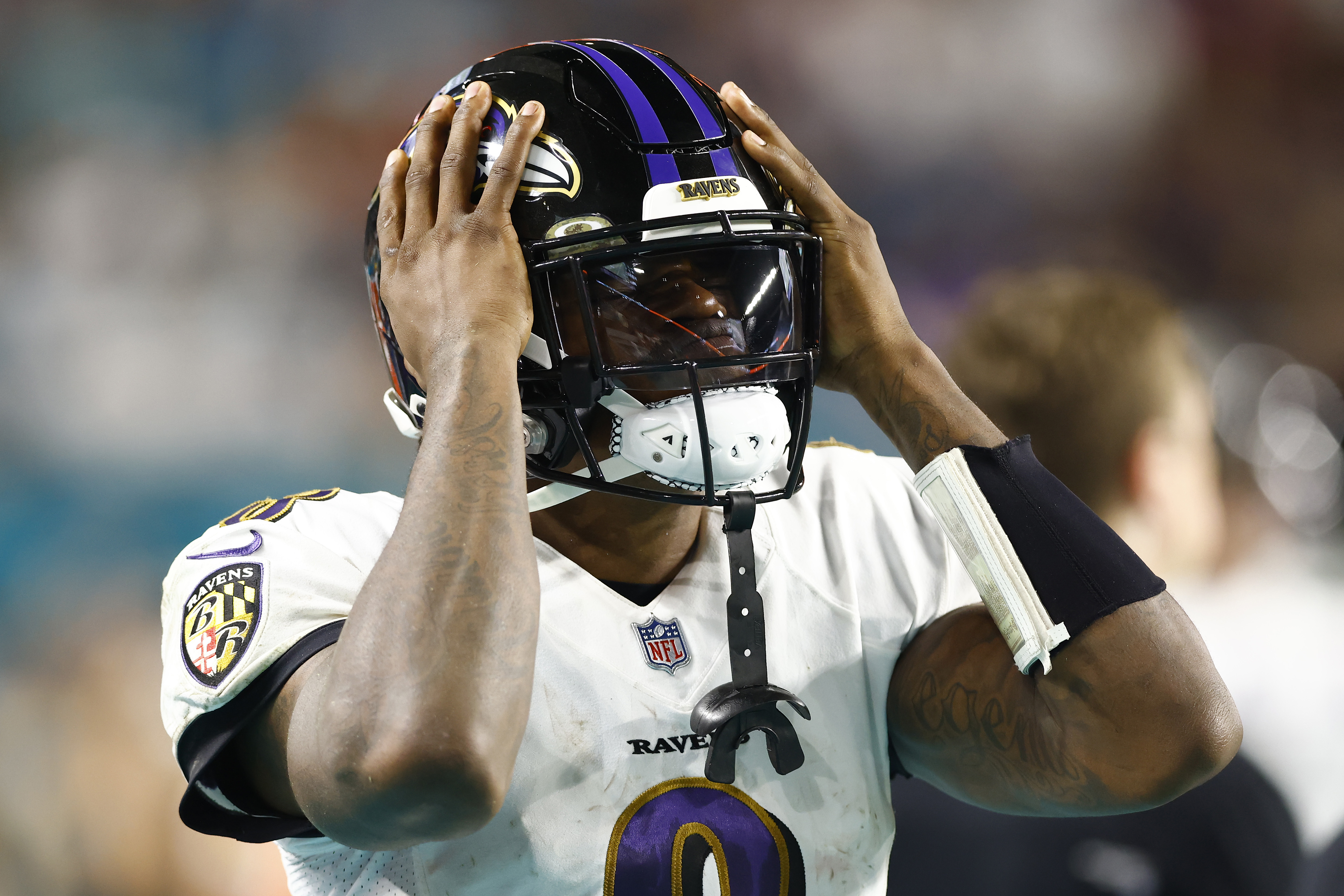 Ravens QB Lamar Jackson reacts while facing the Dolphins
