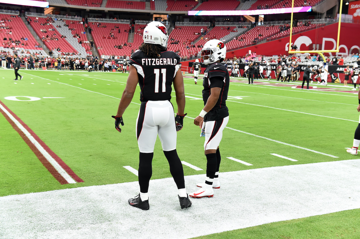 Kyler Murray and Larry Fitzgerald of the Arizona Cardinals prepare for a game against the Atlanta Falcons at State Farm Stadium.