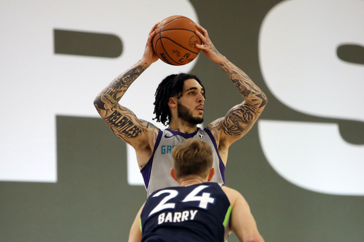 LiAngelo Ball holds the ball over his in a G League game for the Greensboro Swarm, an affiliate of the NBA's Charlotte Hornets.