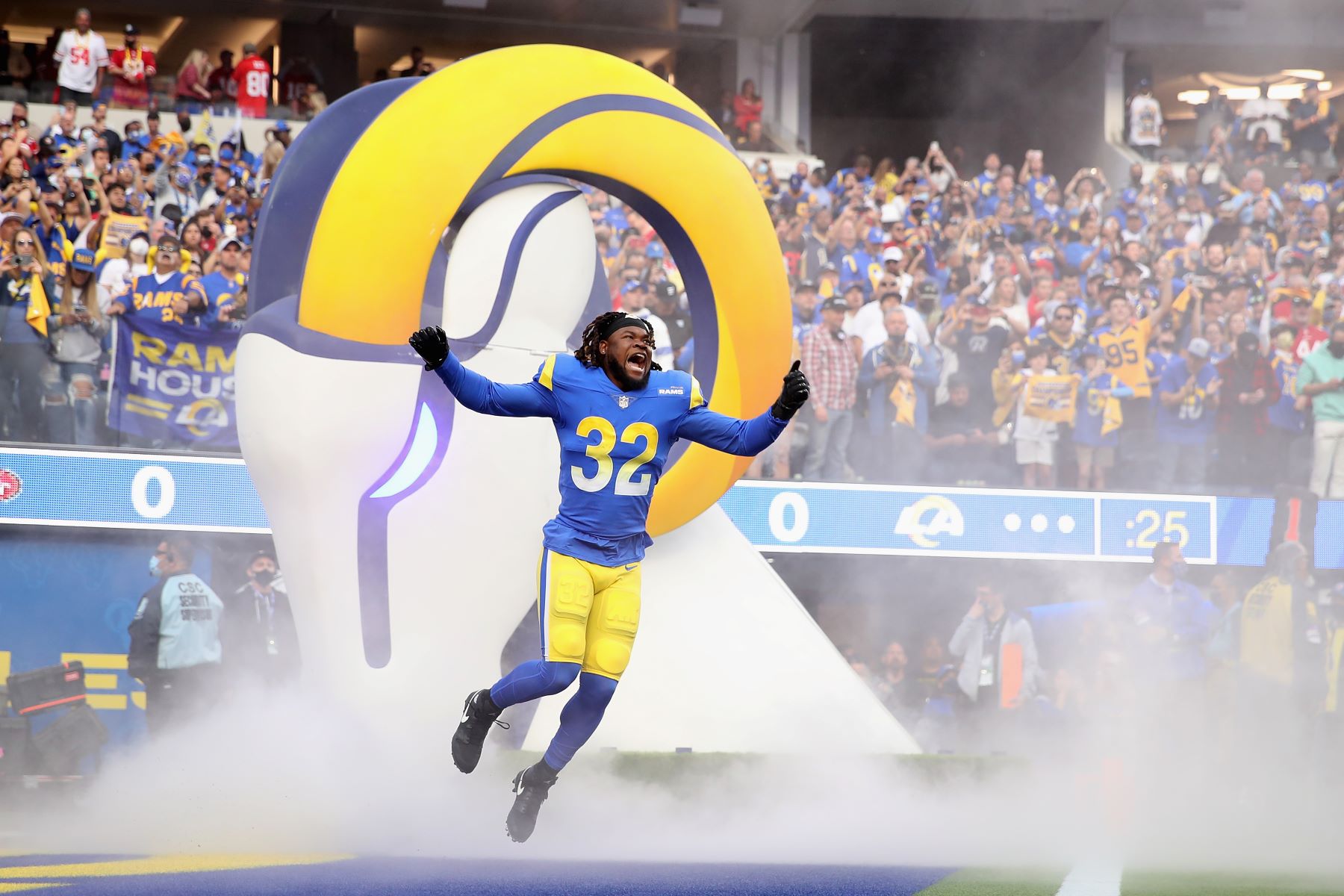 Travin Howard #32 of the Los Angeles Rams running onto the field for NFL playoffs game against the San Francisco 49ers