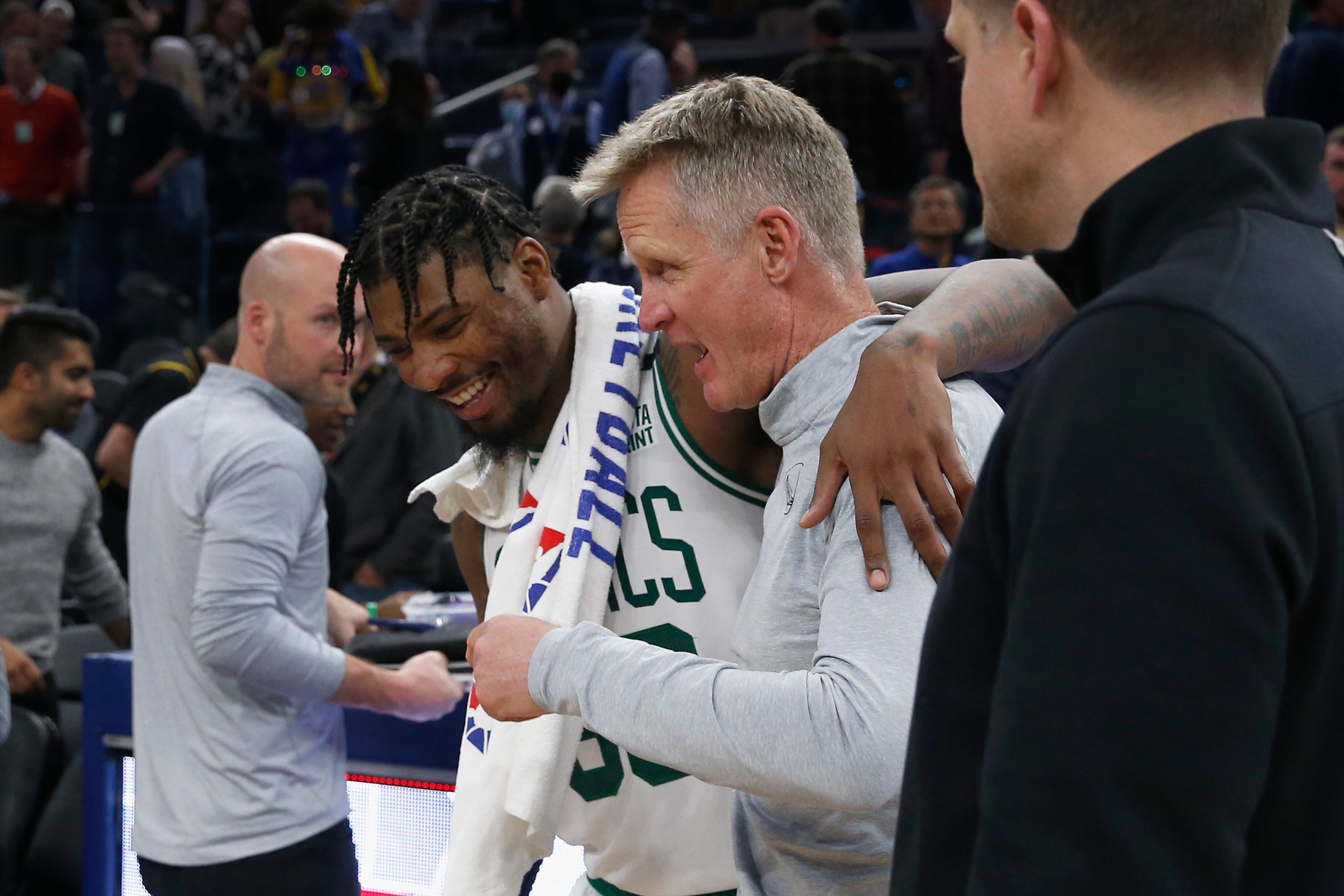 Marcus Smart of the Boston Celtics talks to head coach Steve Kerr of the Golden State Warriors after their game.