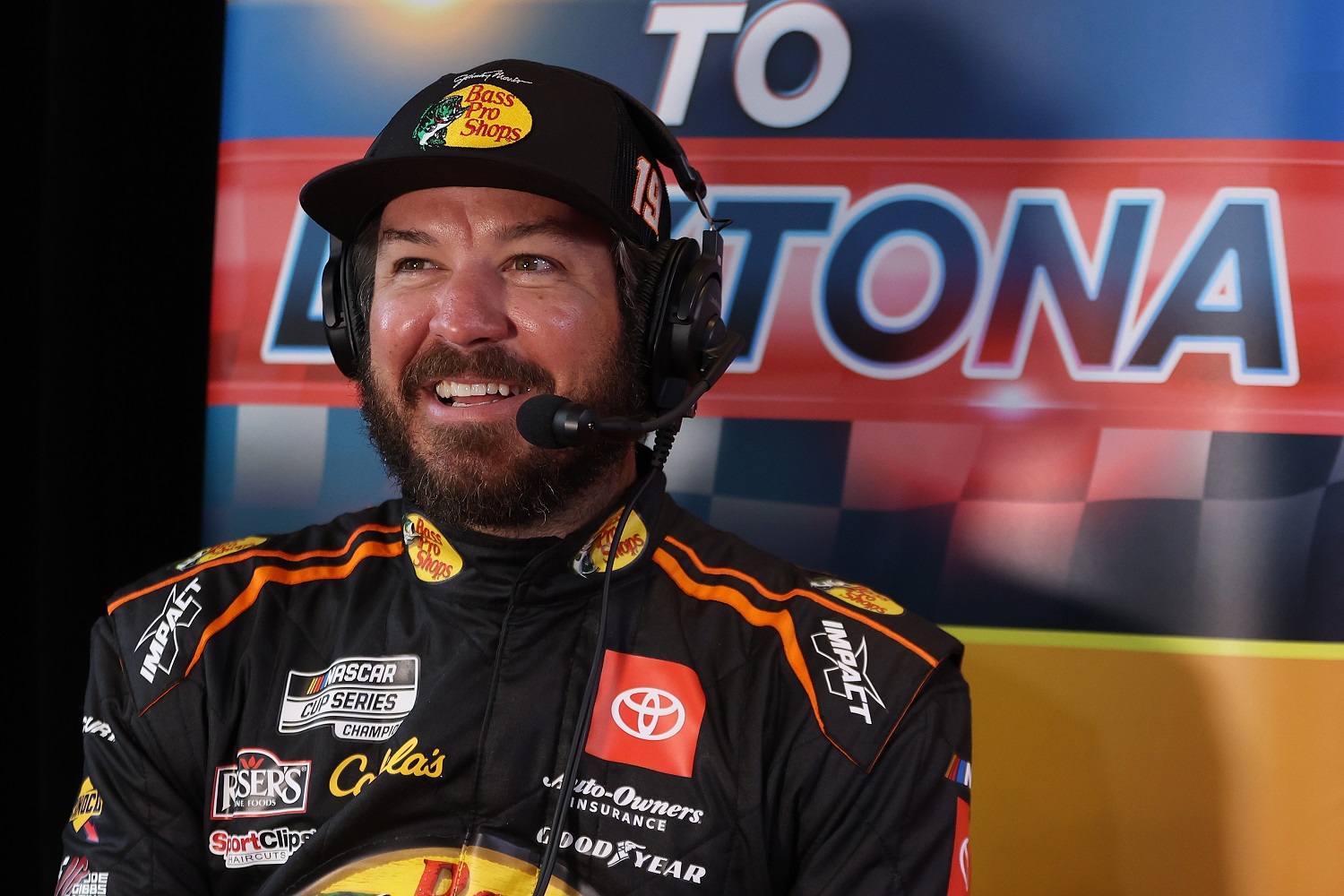 Martin Truex Jr. speaks to reporters during the NASCAR Cup Series Daytona 500 Media Day at Daytona International Speedway on Feb. 16, 2022. | James Gilbert/Getty Images