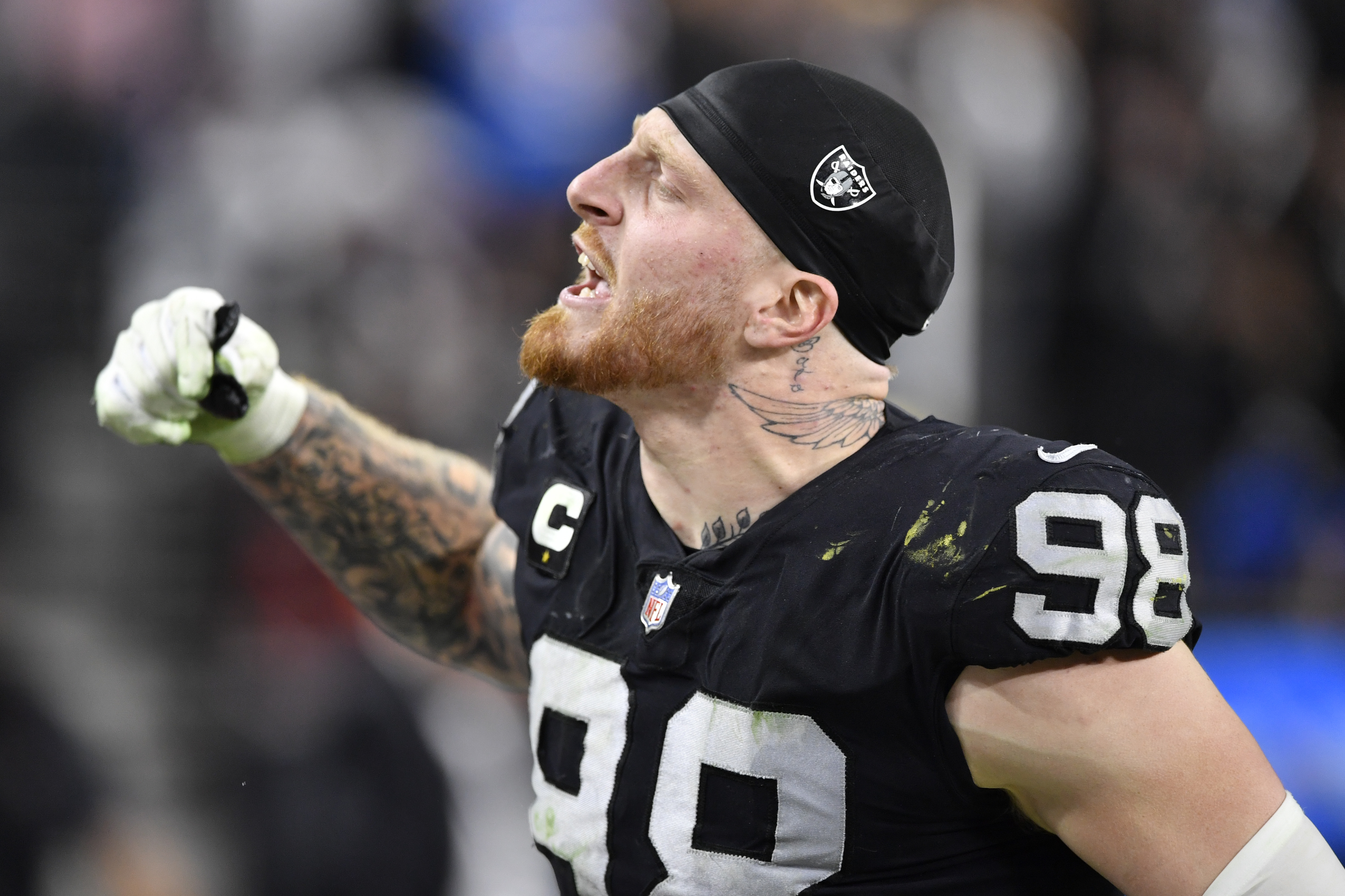 Raiders defensive end Maxx Crosby celebrates a tackle against the Chargers