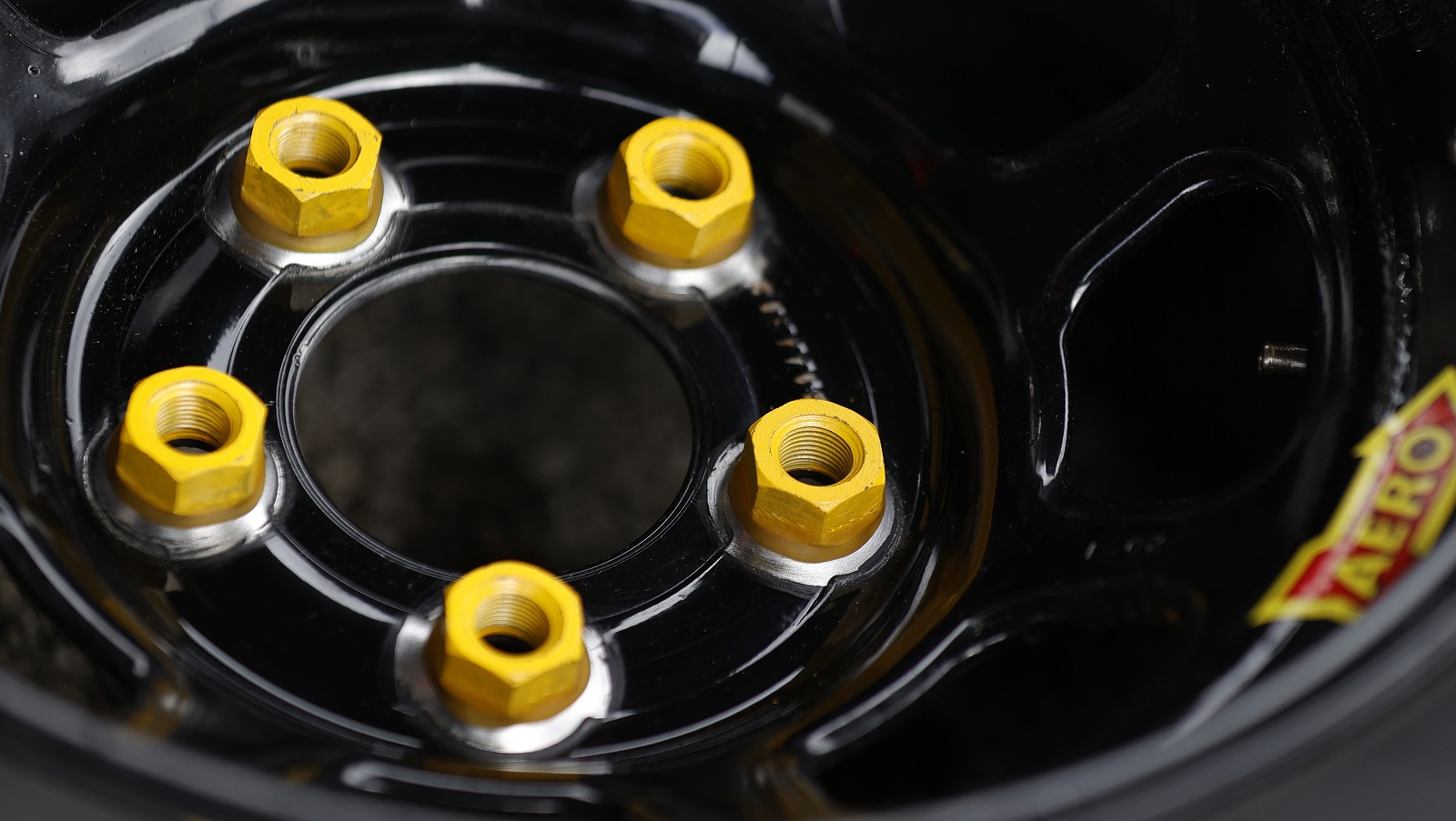 A detail of tire and lug nuts in the 23XI Racing Toyota pit area prior to the 2021 Daytona 500. | Jared C. Tilton/Getty Images