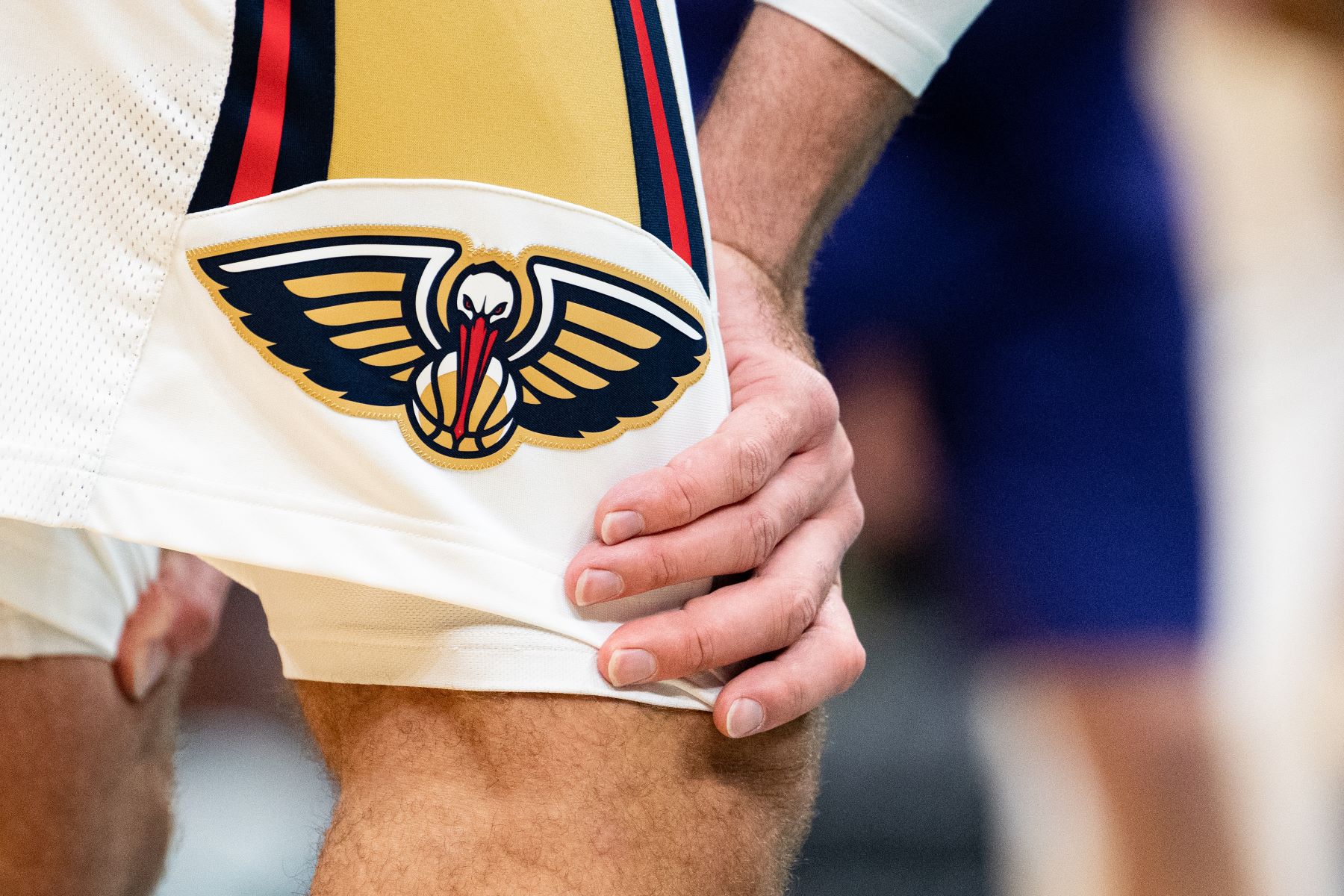 New Orleans Pelicans logo on the shorts of #17 Jonas Valanciunas during a game against the Charlotte Hornets