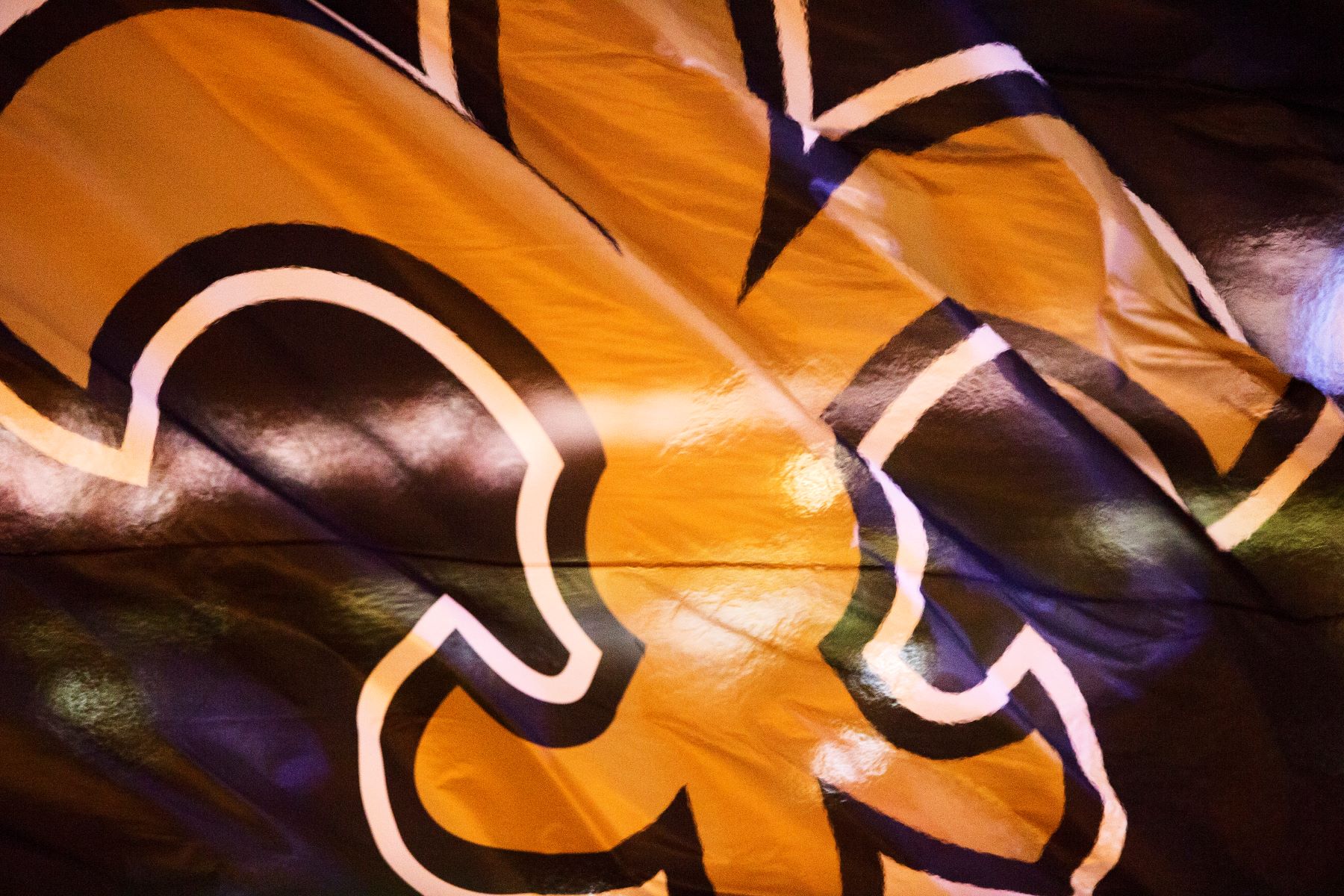 New Orleans Saints NFL team logo on flag on a fluttering flag
