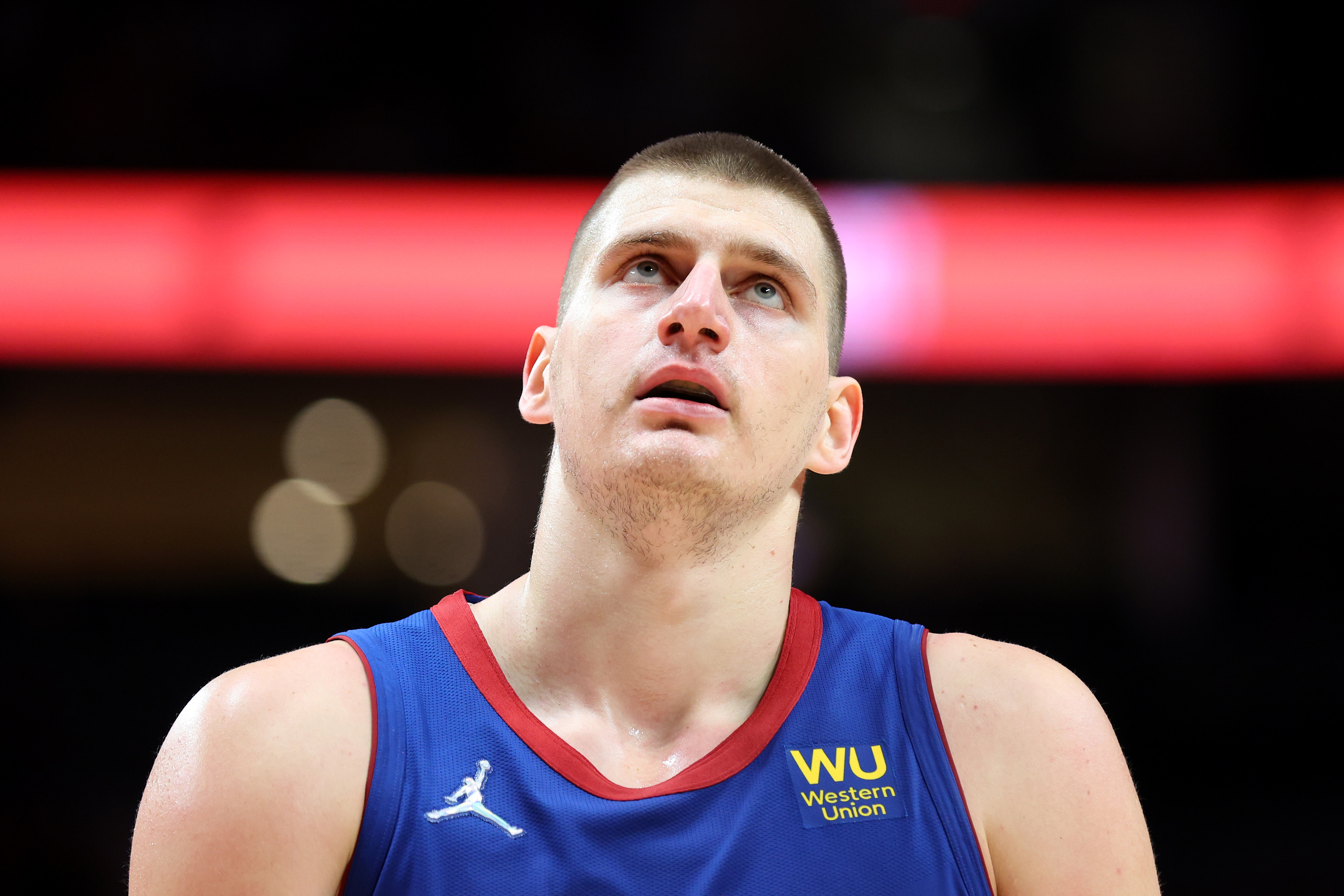 Denver Nuggets center Nikola Jokic looks on during an NBA game against the Portland Trail Blazers in February 2022