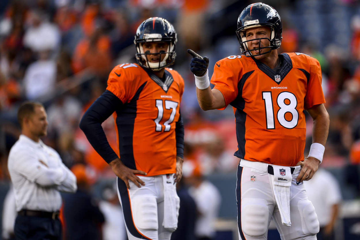 Denver Broncos quarterbacks Peyton Manning (L) and Brock Osweiler in 2014.  