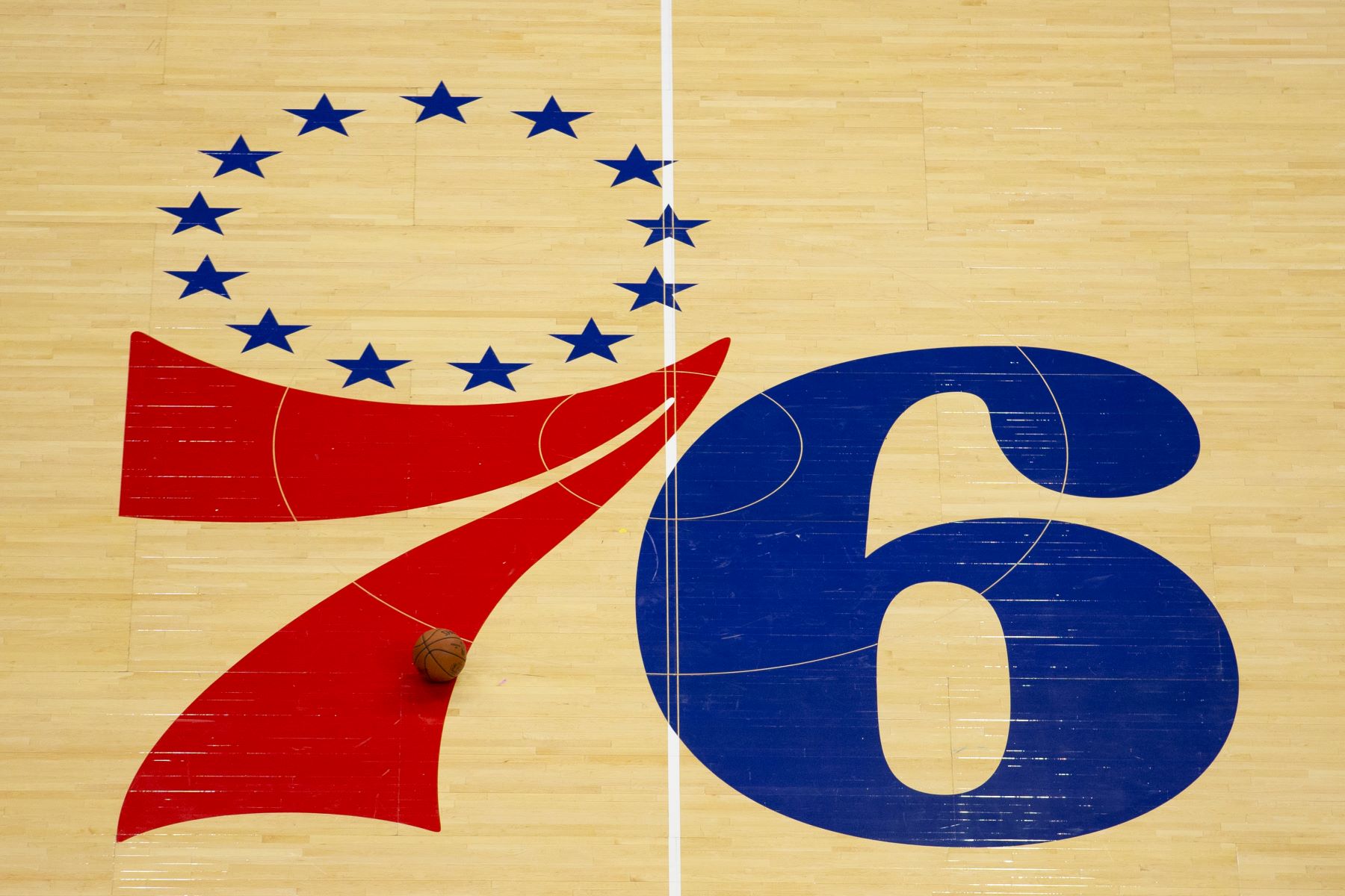 NBA team Philadelphia 76ers logo on the court for a game against the Boston Celtics