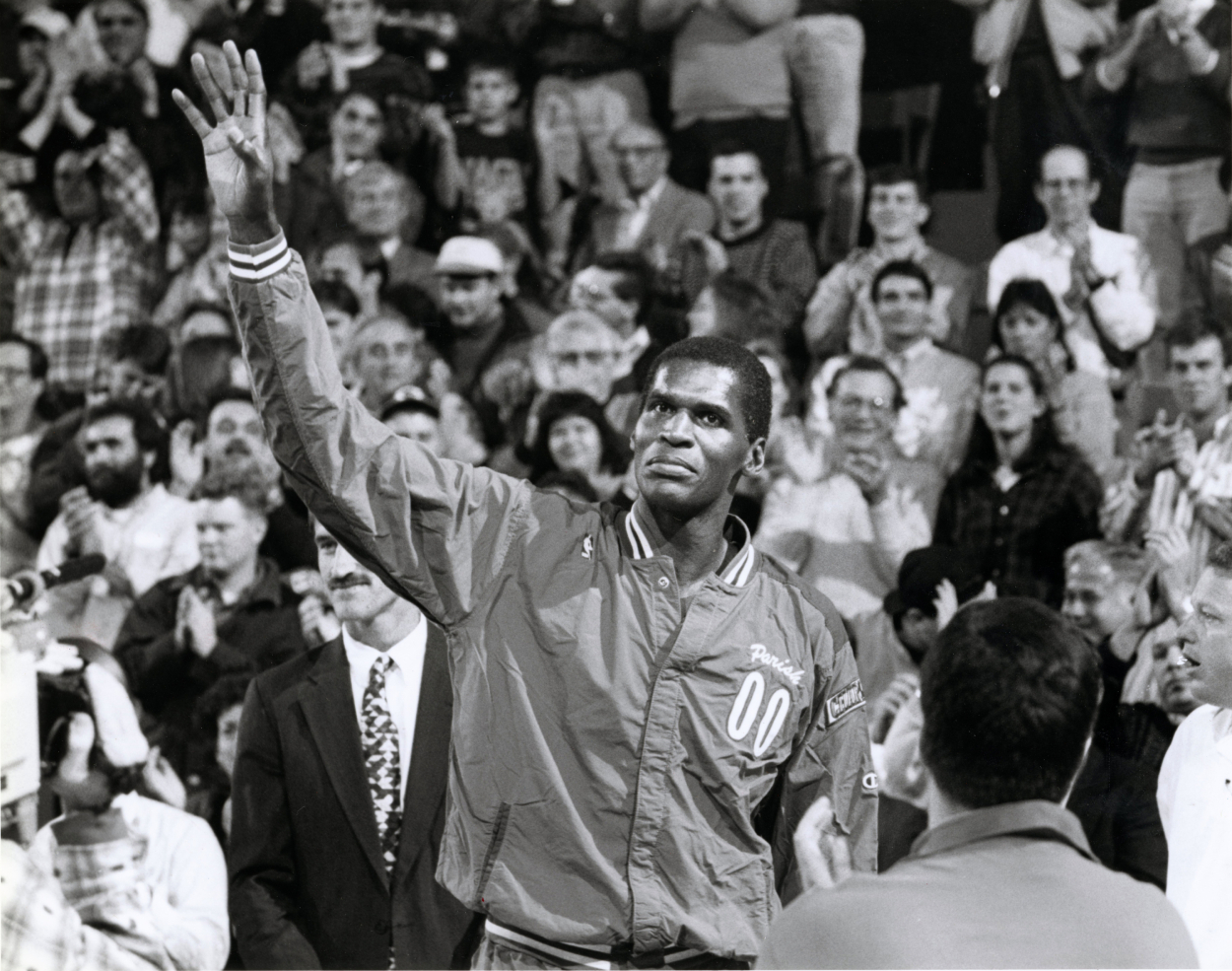 Charlotte Hornets center Robert Parish waves to the crowd during a game against the Boston Celtics at the Boston Garden, Nov. 23, 1994. .