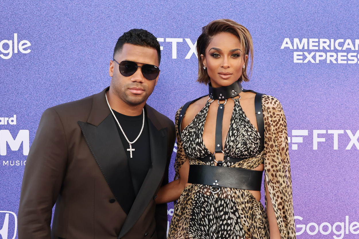 Russell Wilson (pictured with wife and Ciara) is the subject of a trade offer by the Washington Commanders.