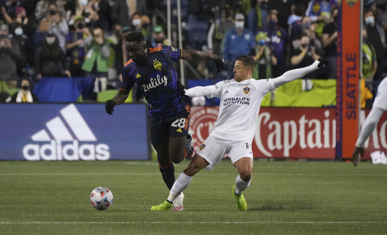 LA Galaxy forward Chicharito defends against Seattle Sounders defender Yeimar Gomez during an MLS match between the LA Galaxy and the Seattle Sounders in 2021