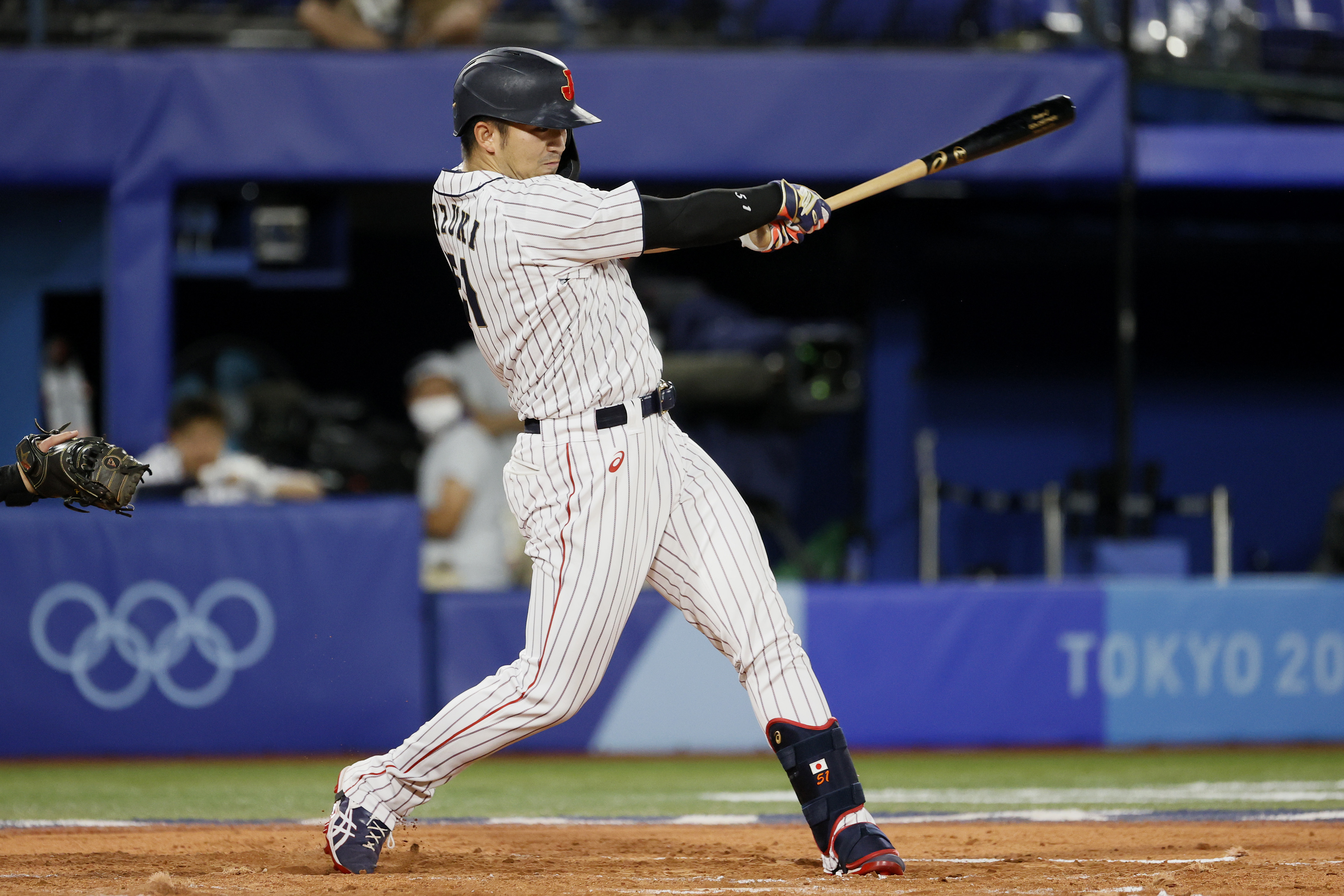 Japanese outfielder Seiya Suzuki swings during the gold medal game in the 2020 Tokyo Olympics