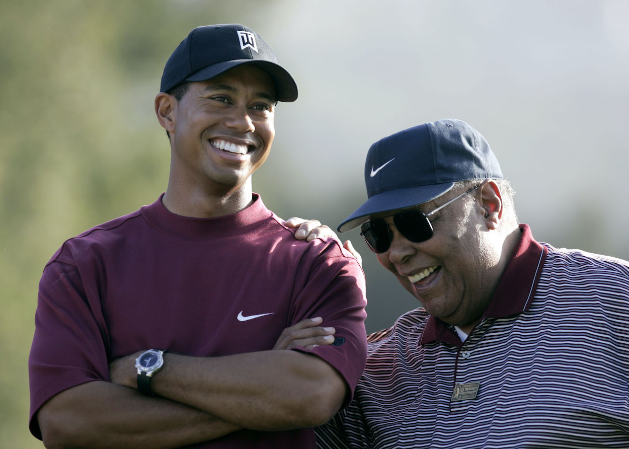Tiger Woods laughs with his father, Earl Woods.