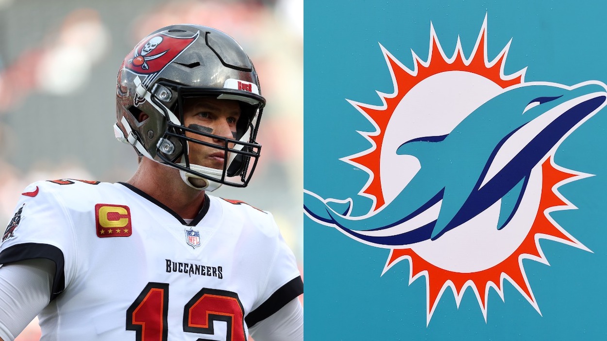 (L-R) Tom Brady of the Tampa Bay Buccaneers looks on during pregame warm-ups prior to a game against the Carolina Panthers; the Miami Dolphins logo.