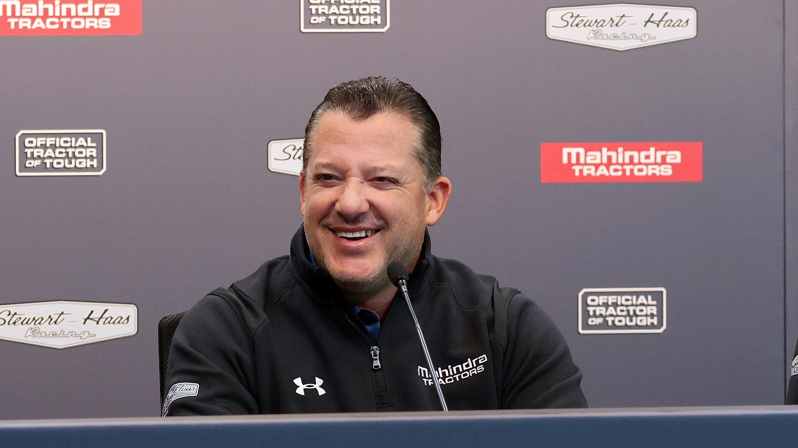 Tony Stewart speaks during a press event announcing a partnership between Stewart-Haas Racing and Mahindra Tractors on Dec. 10, 2021, in Indianapolis, Indiana. | Dylan Buell/Getty Images