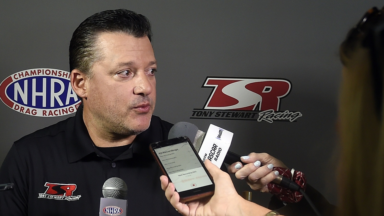 Tony Stewart answers questions at the press conference at the zMAX Dragway on Oct. 14, 2021, in Concord, North Carolina.