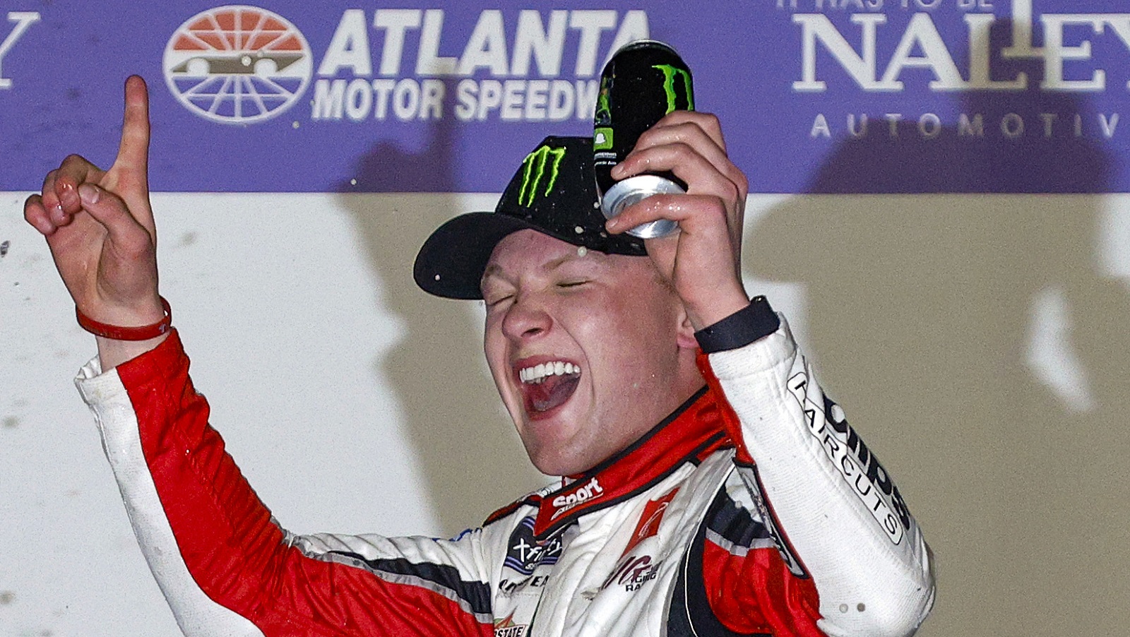 Ty Gibbs, driver of the No. 54 Toyota, celebrates after winning the NASCAR Xfinity Series Nalley Cars 250 at Atlanta Motor Speedway on March 19, 2022.