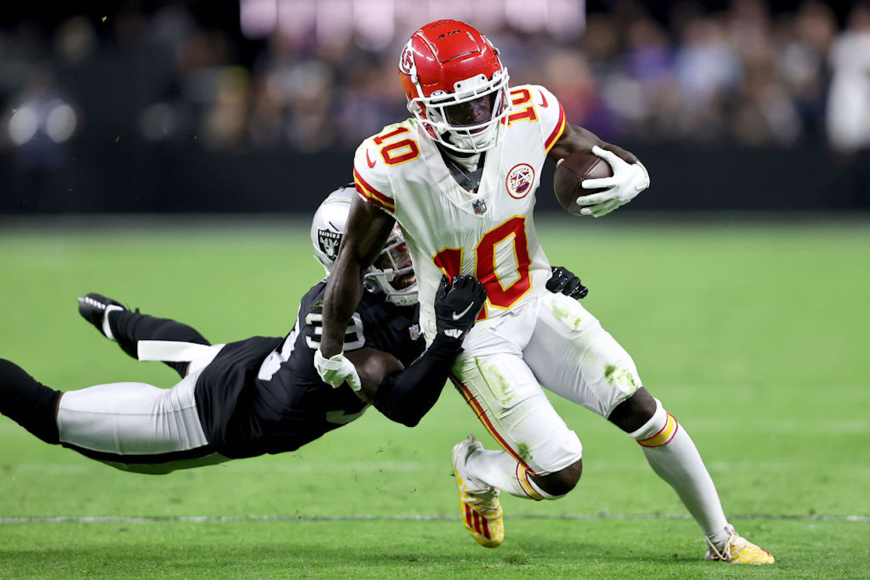 Tyreek Hill runs with the ball as a member of the Kansas City Chiefs.