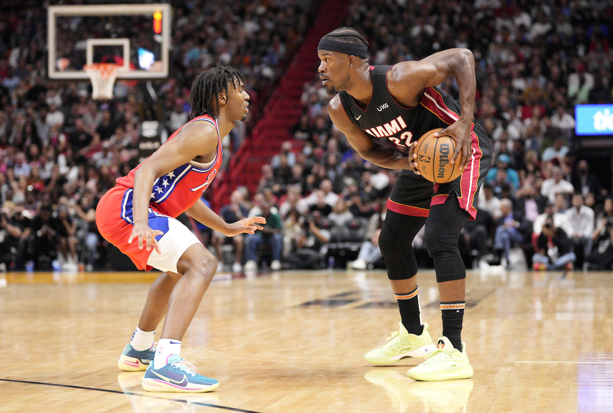 Tyrese Maxey guards Jimmy Butler.