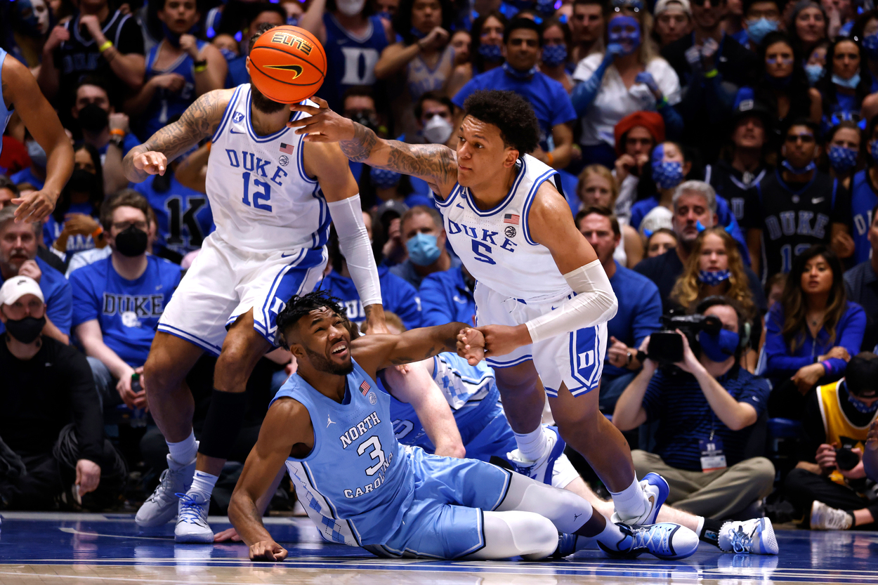 Players from Duke and North Carolina scramble for a loose ball.