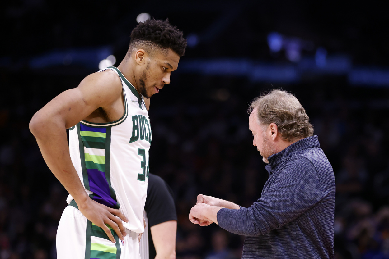 Giannis Antetokounmpo and Mike Budenholzer of the Milwaukee Bucks have a conversation.