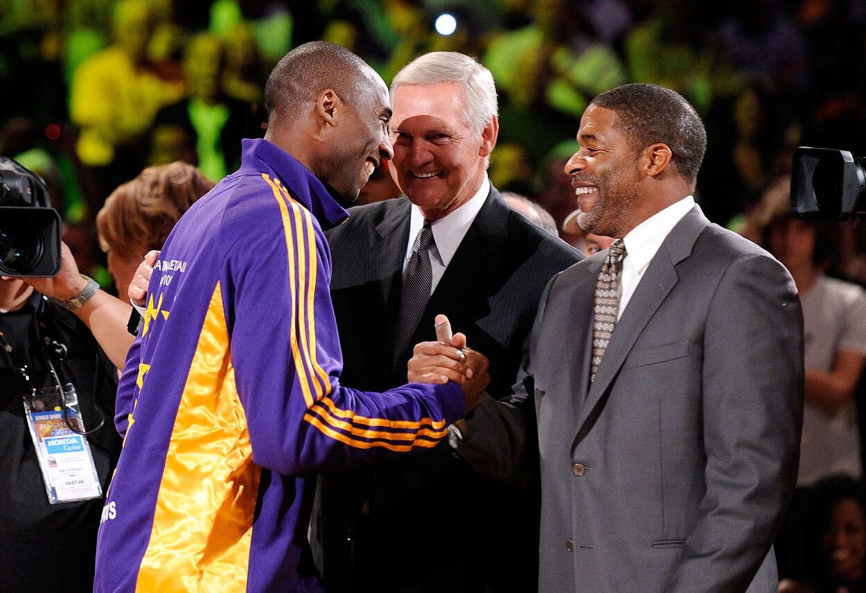 Los Angeles Lakers legend Kobe Bryant engages with Norm Nixon and Jerry West.