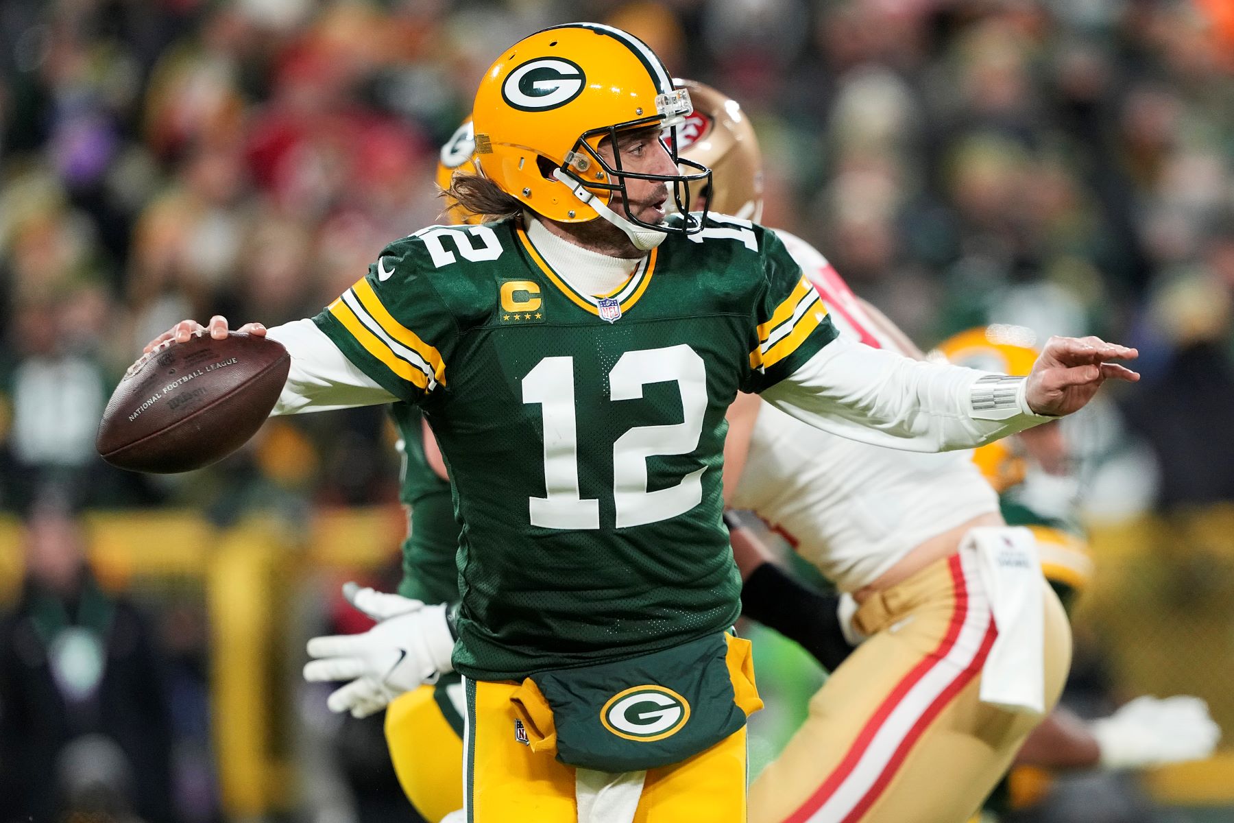 Quarterback Aaron Rodgers as #12 on the Green Bay Packers NFL team during a game against the San Francisco 49ers