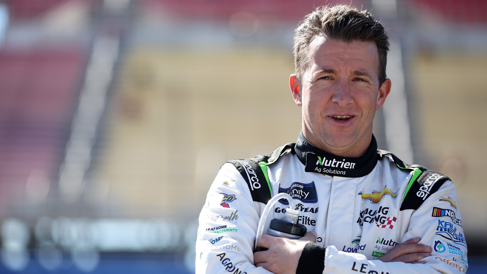 AJ Allmendinger looks on during qualifying for the NASCAR Xfinity Series Production Alliance 300 at Auto Club Speedway on Feb. 26, 2022, in Fontana, California.