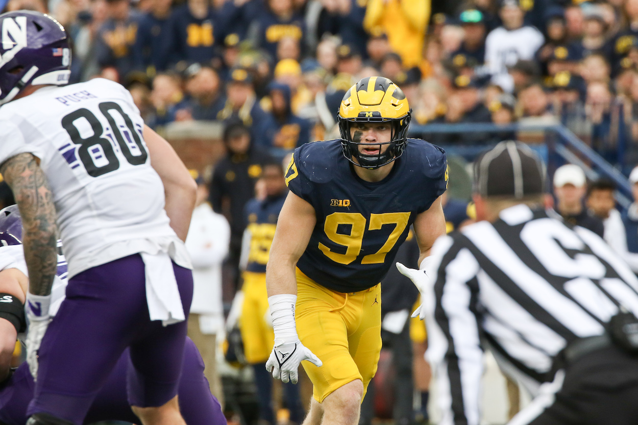 Michigan Wolverines defensive end Aidan Hutchinson waits for the ball to be snapped during a B1G 10 conference football game. He is a top prospect in the 2022 NFL Draft.