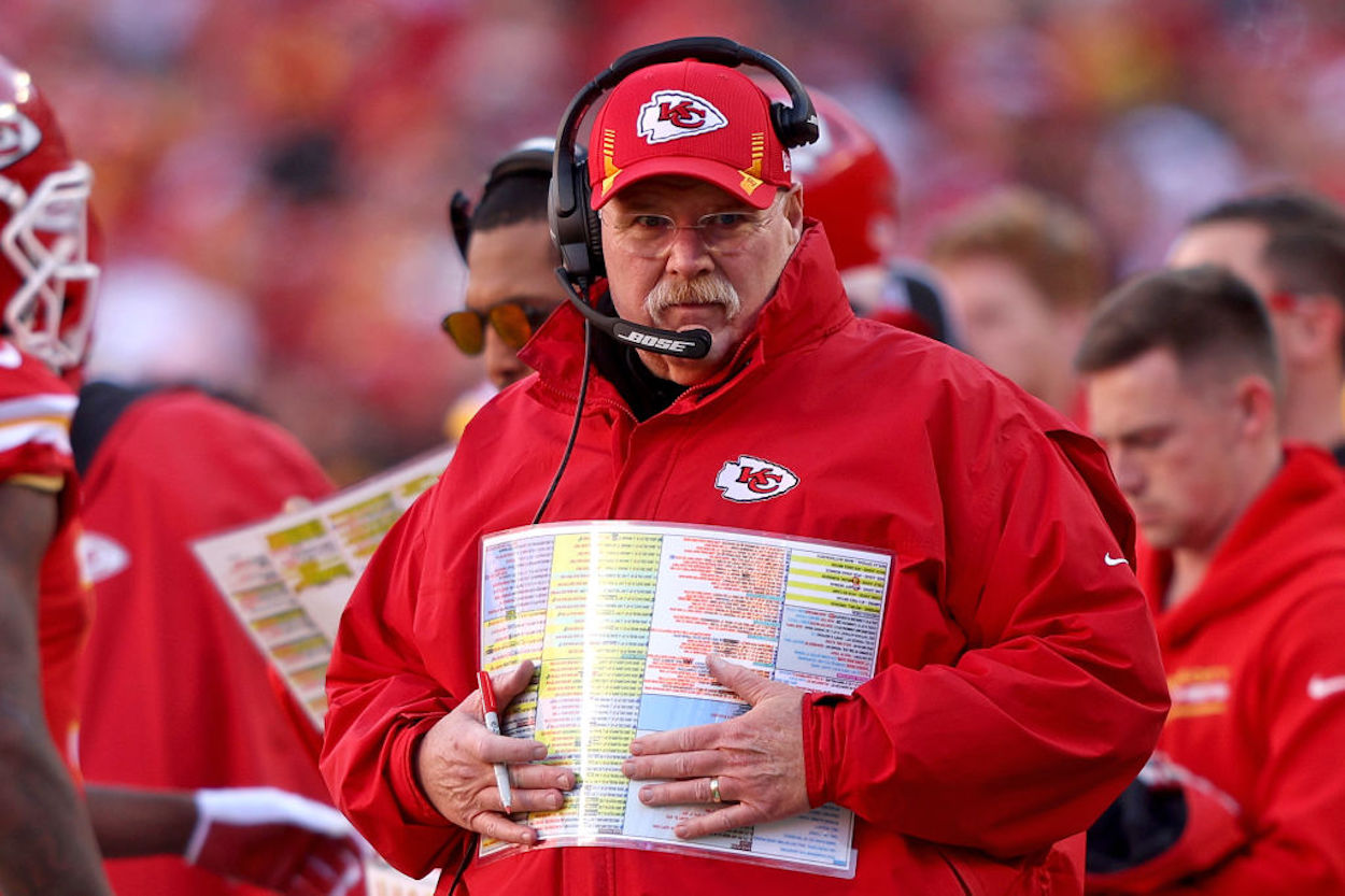 Andy Reid holds his play sheet during a Kansas City Chiefs playoff game.
