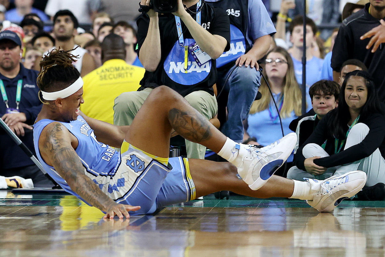 Armando Bacot reacts in pain in the national championship.