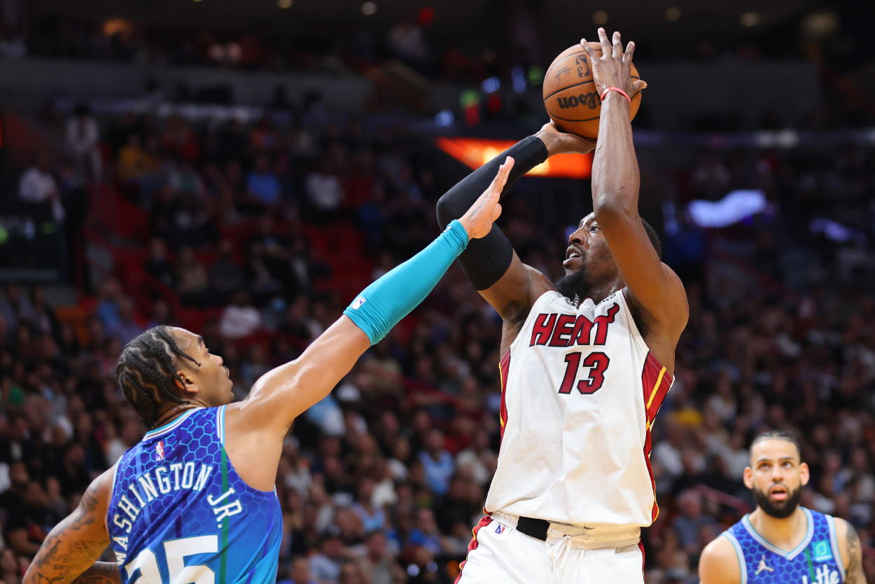 Bam Adebayo of the Miami Heat shoots over P.J. Washington of the Charlotte Hornets.