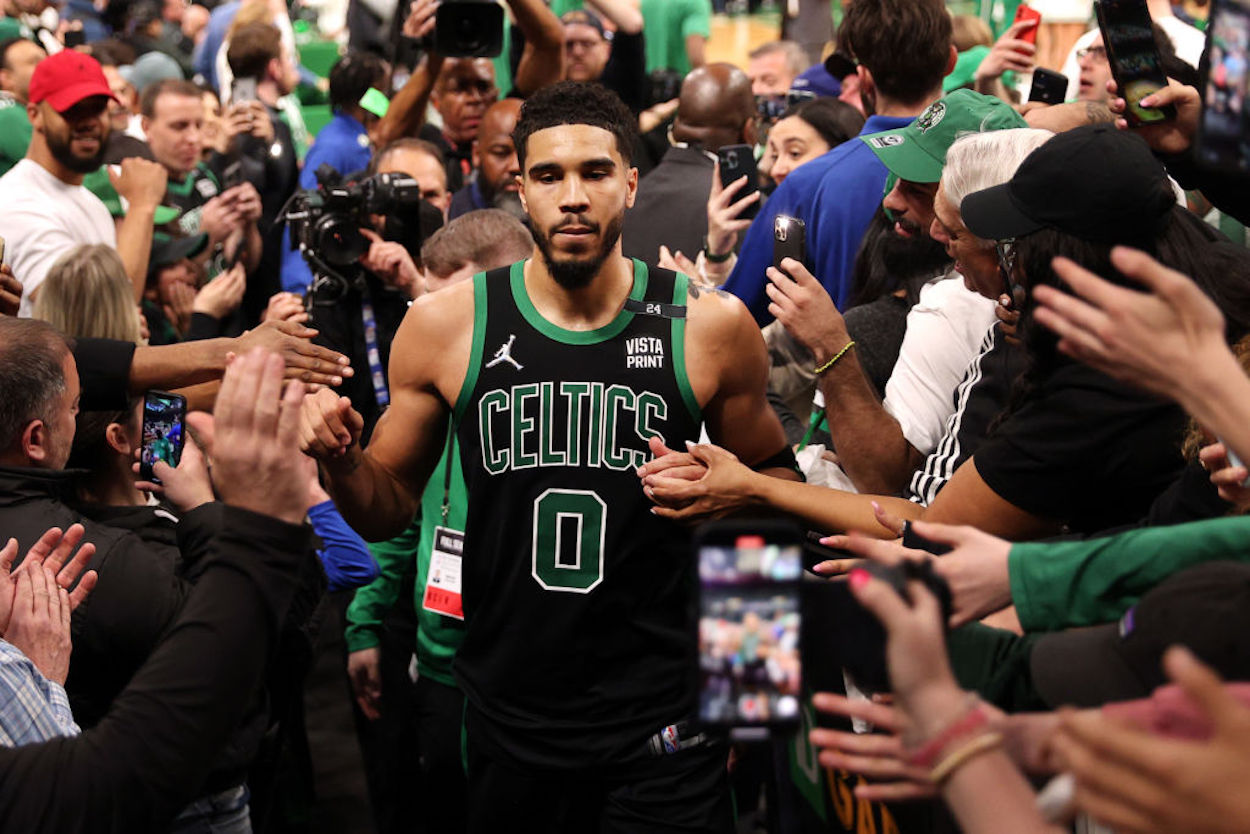 Boston Celtics forward Jayson Tatum with a memorial '24' on his shoulder.