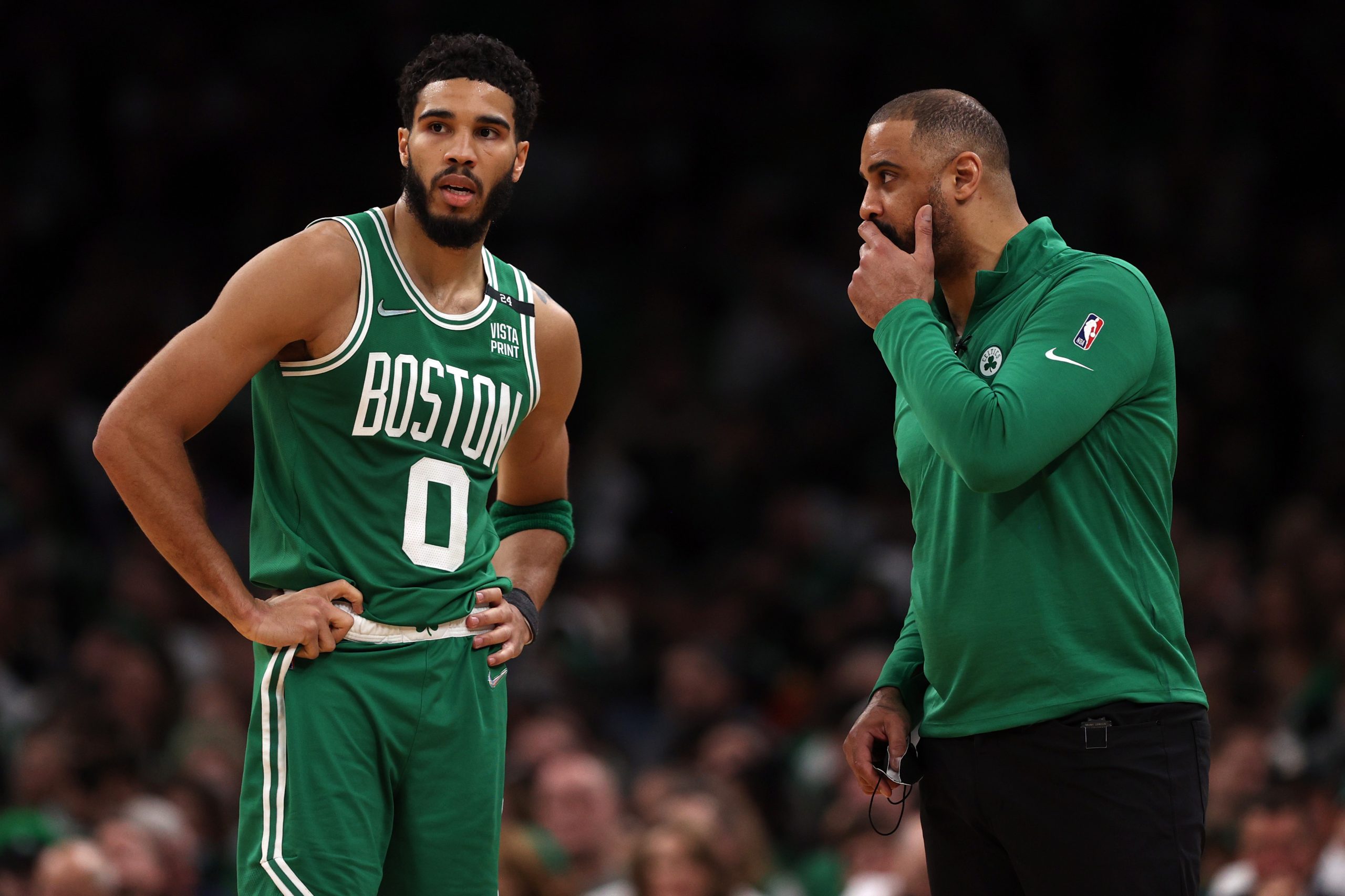 Jayson Tatum of the Boston Celtics talks with head coach Ime Udoka.