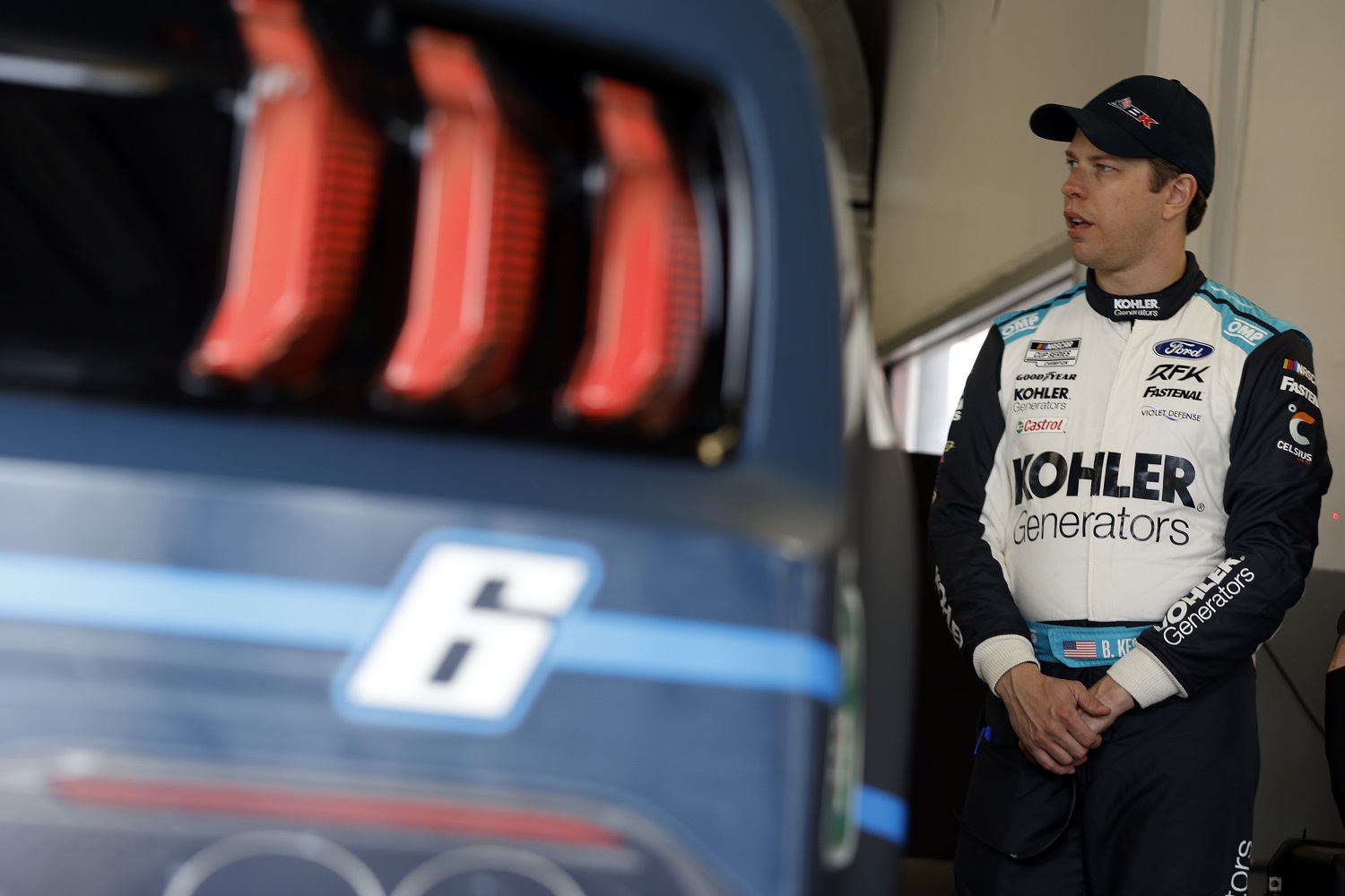Brad Keselowski stands in the garage area during practice for the NASCAR Cup Series Daytona 500 at Daytona International Speedway on Feb. 15, 2022.