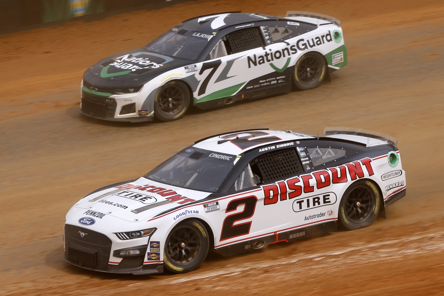Austin Cindric in the No. 2 Ford and Corey LaJoie in the No. 7 Chevrolet practice for the NASCAR Cup Series Food City Dirt Race on April 15, 2022, at Bristol Motor Speedway.