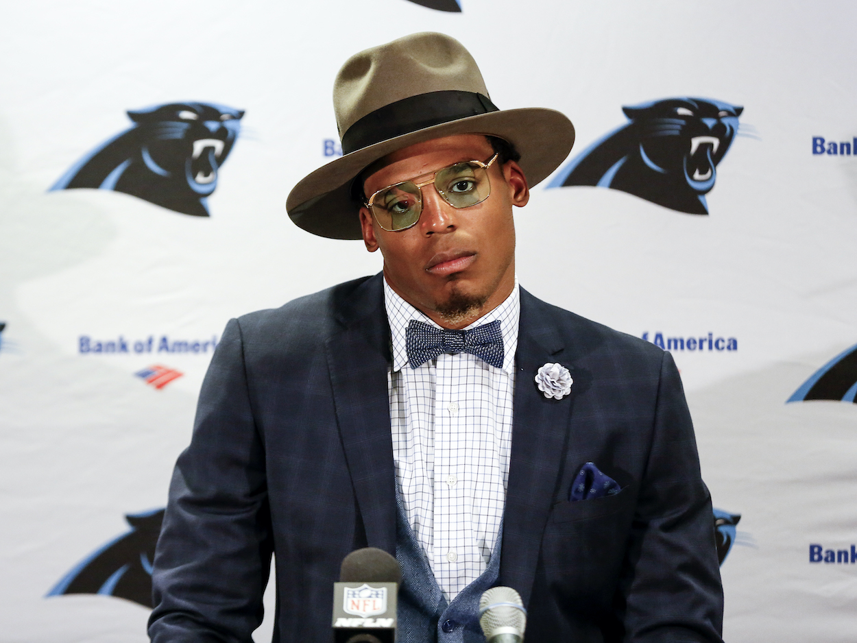 Cam Newton of the Carolina Panthers answers questions from the media at a press conference.